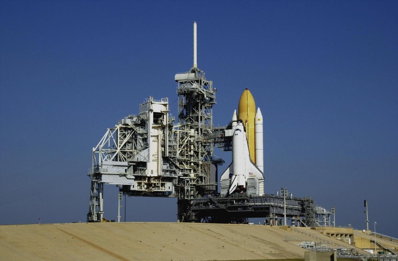 After repair of a cracked cleat on the crawler-transporter, Space Shuttle Endeavour finally rests on Launch Pad 39B. To the left is the Rotating Service Structure. Endeavour is scheduled to be launched Nov. 30 at 10:01 p.m. EST on mission STS-97, the sixth construction flight to the International Space Station. Its payload includes the P6 Integrated Truss Structure and a photovoltaic (PV) module, with giant solar arrays that will provide power to the Station. The mission includes two spacewalks to complete the solar array connections