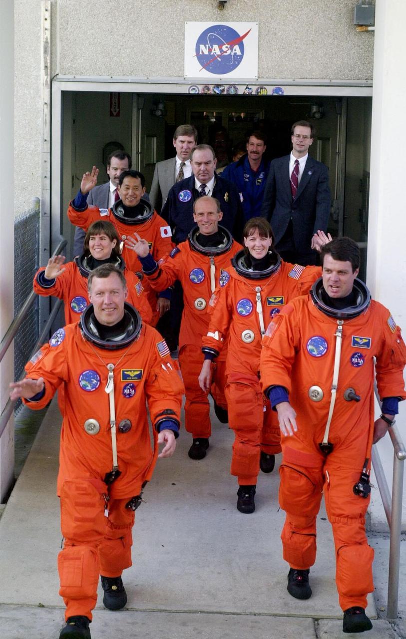 The STS-99 crew wave to onlookers as they step eagerly from the Operations and Checkout Building enroute to Launch Pad 39A for liftoff of Space Shuttle Endeavour. In their orange launch and entry suits, they are (foreground) Pilot Dominic Gorie and Commander Kevin Kregel. Behind them (left to right) are Mission Specialists Janice Voss, Mamoru Mohri of Japan, Gerhard Thiele of Germany and Janet Lynn Kavandi. Mohri is with the National Space Development Agency (NASDA) of Japan, and Thiele is with the European Space Agency. Known as the Shuttle Radar Topography Mission (SRTM), STS-99 is scheduled for liftoff at 12:30 p.m. EST. The SRTM will chart a new course to produce unrivaled 3-D images of the Earth's surface. The result of the Shuttle Radar Topography Mission could be close to 1 trillion measurements of the Earth's topography. The mission is expected to last 11days, with Endeavour landing at KSC Tuesday, Feb. 22, at 4:36 p.m. EST. This is the 97th Shuttle flight and 14th for Shuttle Endeavour