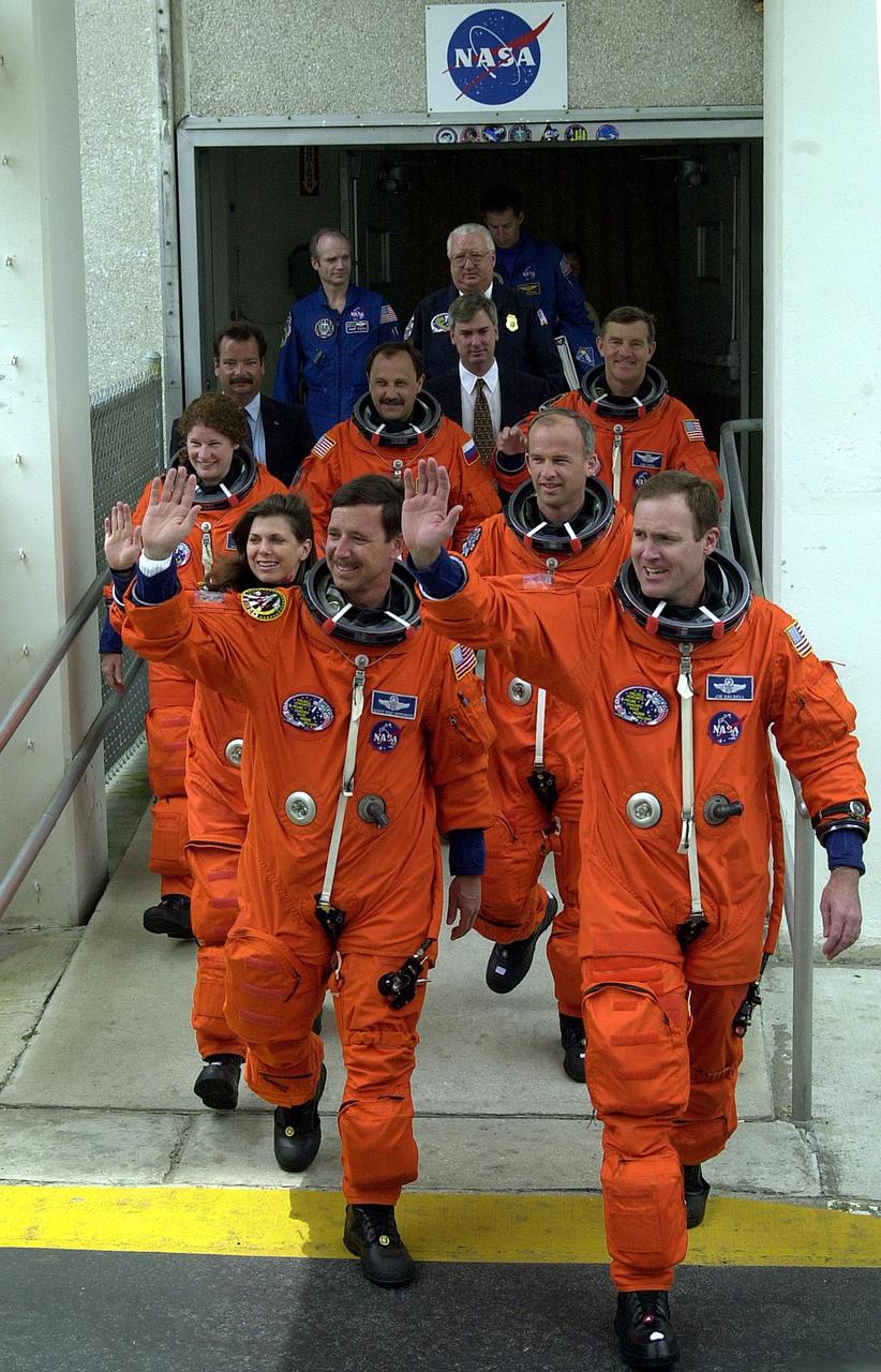 (Nikon D1 Test) The STS-101 crew wave to onlookers as they leave the Operations and Checkout Building enroute for the second time to Launch Pad 39A and another attempt at liftoff of Space Shuttle Atlantis. In their orange launch and entry suits, they are (front line) Pilot Scott J. Horowitz and Commander James D. Halsell Jr.; (second line) Mission Specialists Mary Ellen Weber and Jeffrey N. Williams; and (third line) Mission Specialists Susan J. Helms, Yury Usachev of Russia and James S. Voss The first attempt on April 24 was scrubbed due to unfavorable weather conditions. The mission will take the crew to the International Space Station to deliver logistics and supplies and to prepare the Station for the arrival of the Zvezda Service Module, expected to be launched by Russia in July 2000. Also, the crew will conduct one space walk. This will be the third assembly flight to the Space Station. Liftoff is targeted for 3:52 p.m. EDT. The mission is expected to last about 10 days, with Atlantis landing at KSC Saturday, May 6, about 11:53 a.m. EDT