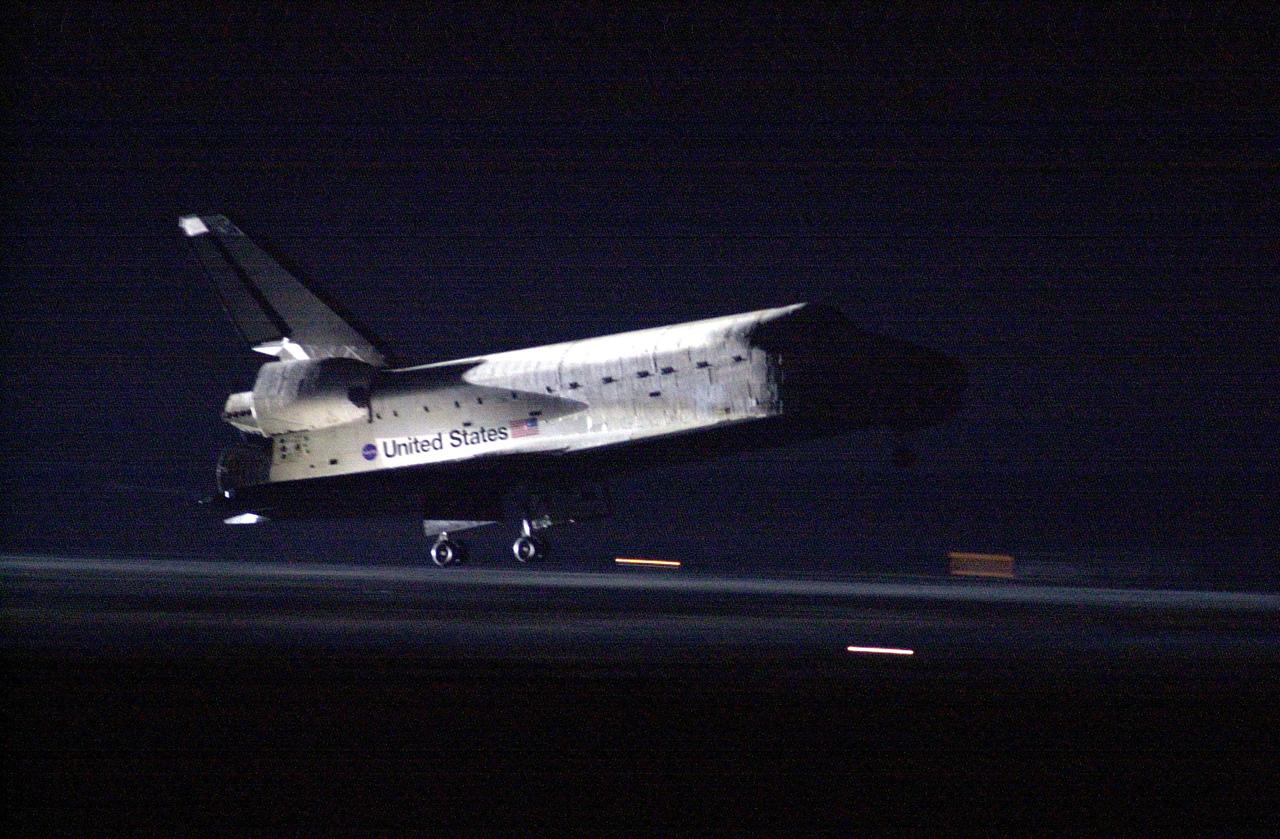 KENNEDY SPACE CENTER, Fla. -- Landing lights spotlight Space Shuttle Atlantis as it nears touchdown on Runway 15 at KSC’s Shuttle Landing Facility after completing the 9-day, 20-hour, 9-minute-long STS-101 mission. At the controls are Commander James D. Halsell Jr. and Pilot Scott “Doc” Horowitz. Also onboard the orbiter are Mission Specialists Mary Ellen Weber, James S. Voss, Jeffrey N. Williams, Susan J. Helms and Yury Usachev of Russia. The crew is returning from the third flight to the International Space Station. This was the 98th flight in the Space Shuttle program and the 21st for Atlantis, also marking the 51st landing at KSC, the 22nd consecutive landing at KSC, and the 29th in the last 30 Shuttle flights. Main gear touchdown was at 2:20:17 a.m. EDT, landing on orbit 155 of the mission. Nose gear touchdown was at 2:20:30 a.m. EDT, and wheel stop at 2:21:19 a.m. EDT