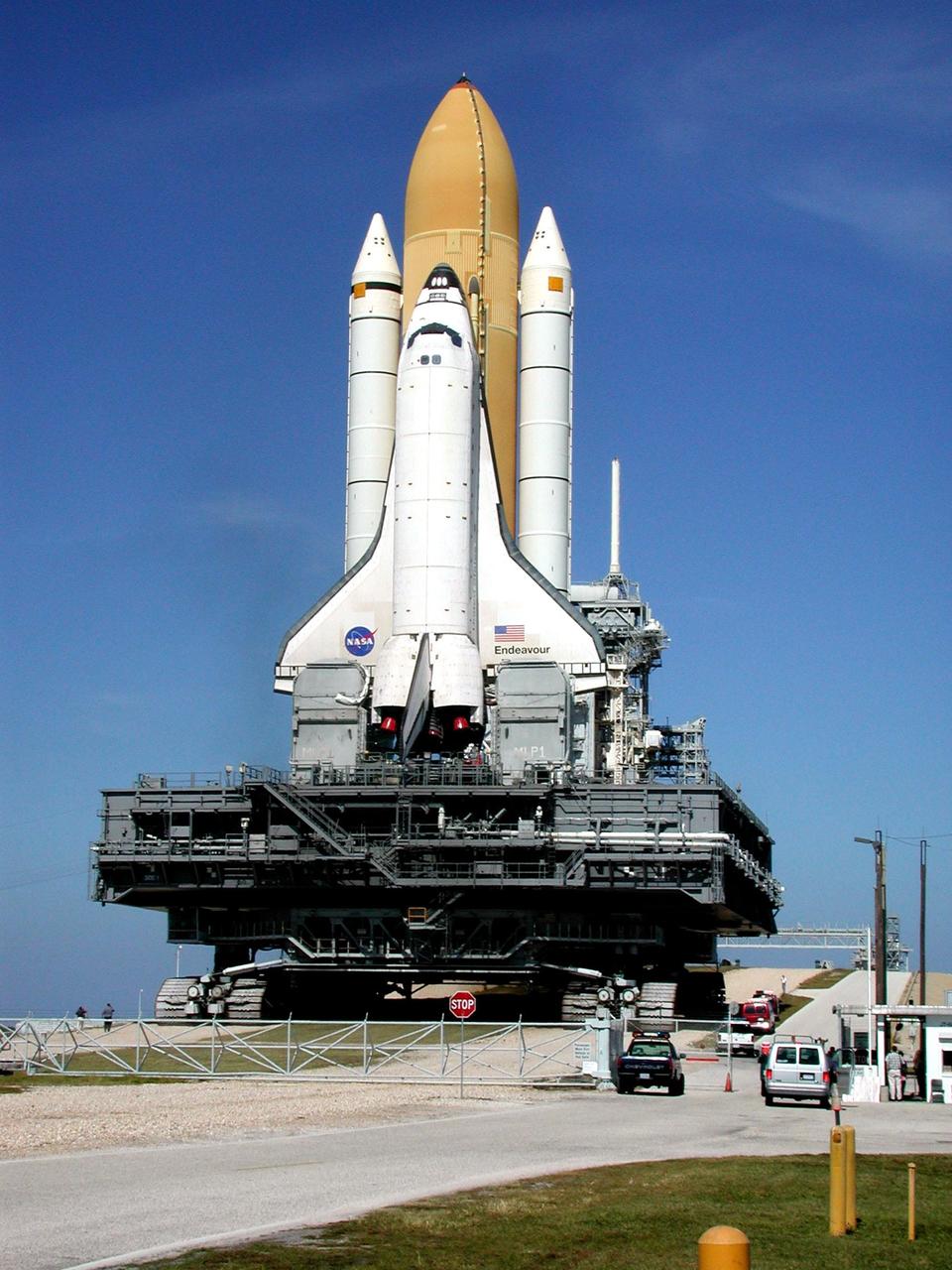 KENNEDY SPACE CENTER, Fla. -- Inside the gate to Launch Pad 39B, Space Shuttle Endeavour and the Mobile Launcher Platform (MLP) start up the incline to the top of the pad. The crawler-transporter beneath the MLP, which moves the Shuttle at about 1 mph, has a leveling system designed to keep the top of the Space Shuttle vertical while negotiating the 5 percent grade leading to the top of the pad. Endeavour is scheduled to be launched Nov. 30 at 10:01 p.m. EST on mission STS-97, the sixth construction flight to the International Space Station. Its payload includes the P6 Integrated Truss Structure and a photovoltaic (PV) module, with giant solar arrays that will provide power to the Station. The mission includes two spacewalks to complete the solar array connections