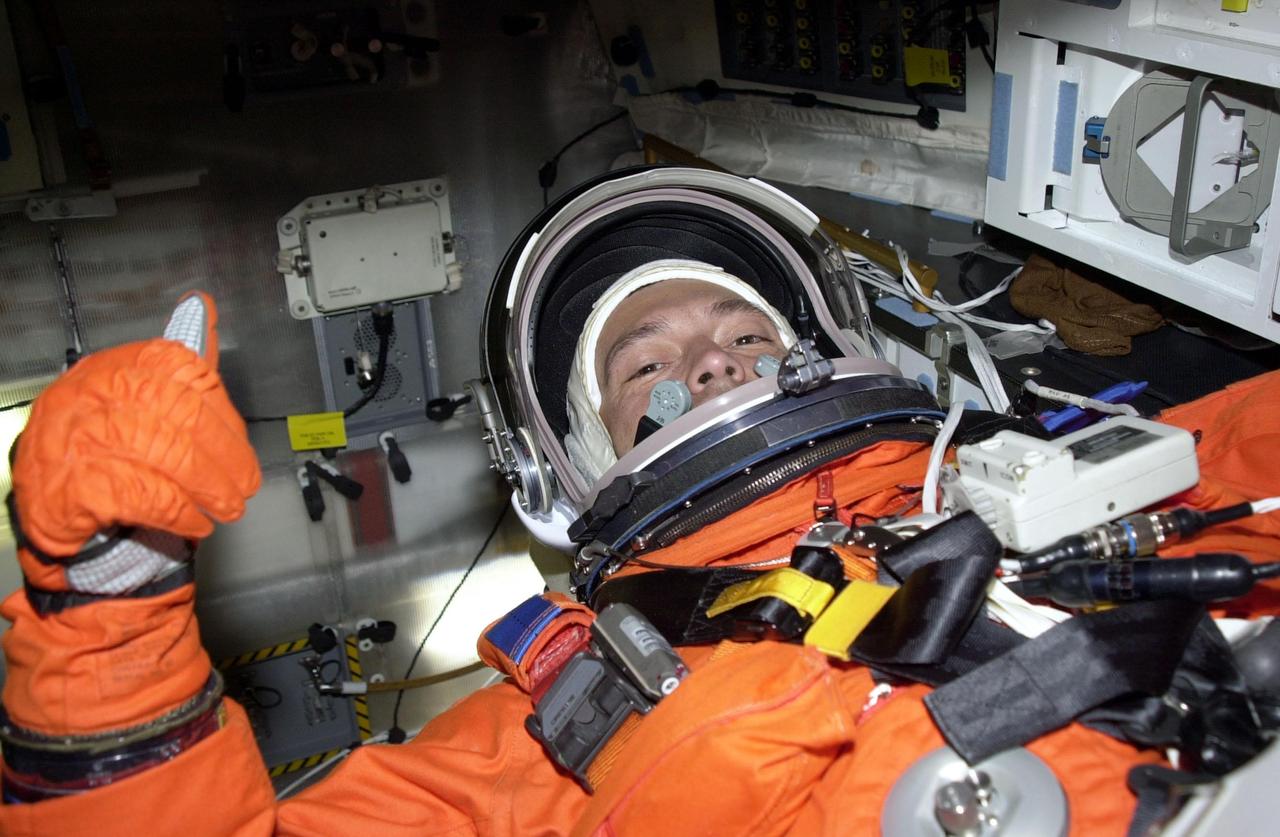 STS-97 Mission Specialist Carlos Noriega settles into his seat in Space Shuttle Endeavour on Launch Pad 39B. He and the rest of the crew are taking part in a simulated launch countdown, part of Terminal Countdown Demonstration Test activities that also include emergency egress training and familiarization with the payload. Mission STS-97 is the sixth construction flight to the International Space Station. Its payload includes the P6 Integrated Truss Structure and a photovoltaic (PV) module, with giant solar arrays that will provide power to the Station. The mission includes two spacewalks to complete the solar array connections. STS-97 is scheduled to launch Nov. 30 at about 10:05 p.m. EST