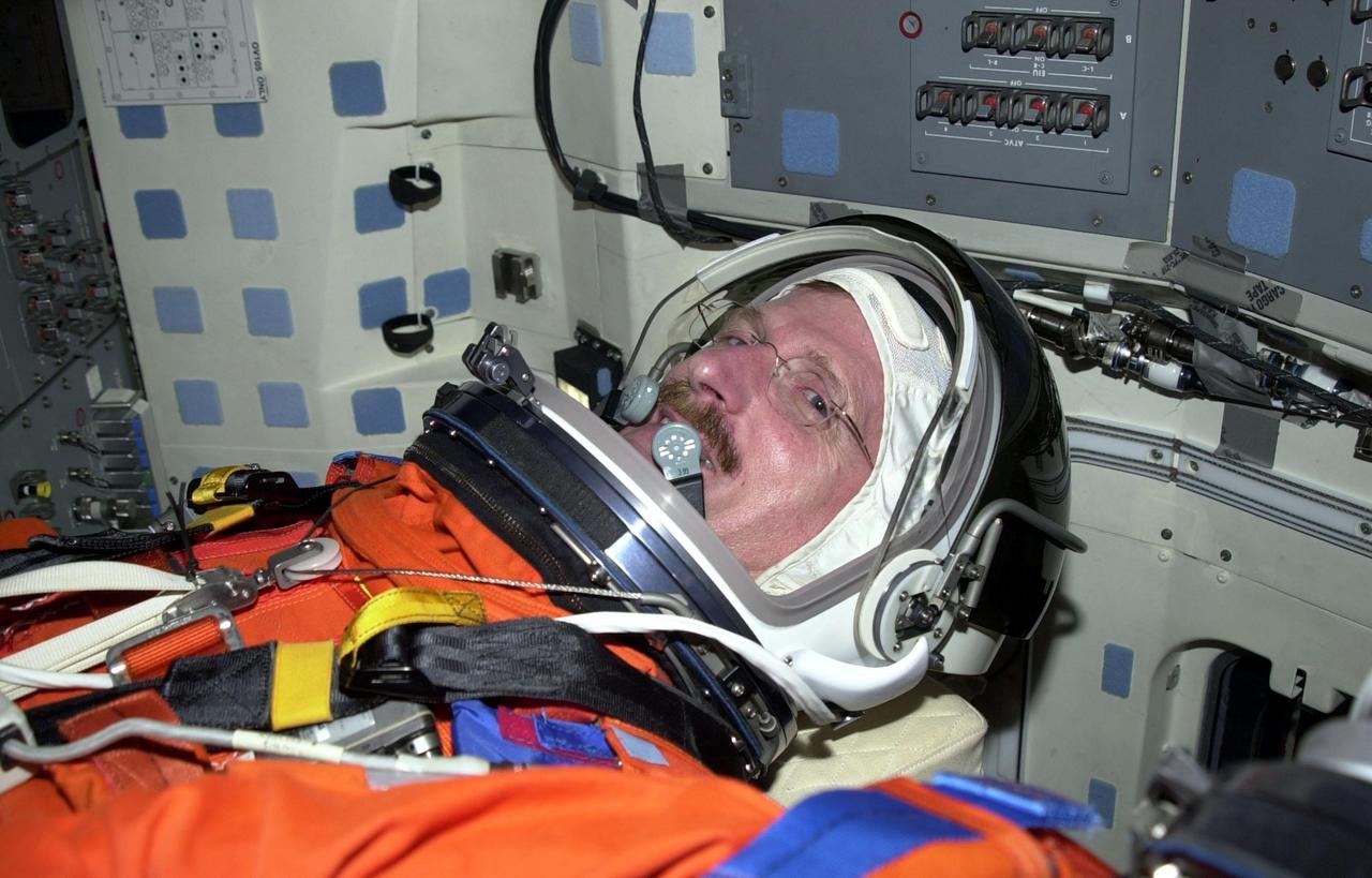 STS-97 Mission Specialist Joe Tanner settles into his seat in Space Shuttle Endeavour on Launch Pad 39B. He and the rest of the crew are taking part in a simulated launch countdown, part of Terminal Countdown Demonstration Test activities that also include emergency egress training and familiarization with the payload. Mission STS-97 is the sixth construction flight to the International Space Station. Its payload includes the P6 Integrated Truss Structure and a photovoltaic (PV) module, with giant solar arrays that will provide power to the Station. The mission includes two spacewalks to complete the solar array connections. STS-97 is scheduled to launch Nov. 30 at 10:05 p.m. EST