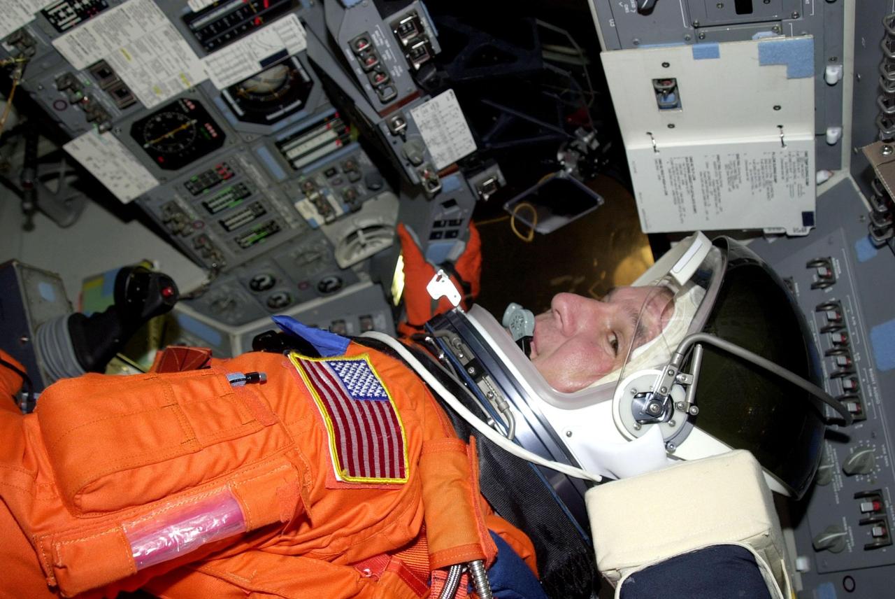 STS-97 Pilot Mike Bloomfield reaches for the control panel as he settles into his seat in the cockpit on Space Shuttle Endeavour on Launch Pad 39B. He and the rest of the crew are taking part in a simulated launch countdown, part of Terminal Countdown Demonstration Test activities that also include emergency egress training and familiarization with the payload. Mission STS-97 is the sixth construction flight to the International Space Station. Its payload includes the P6 Integrated Truss Structure and a photovoltaic (PV) module, with giant solar arrays that will provide power to the Station. The mission includes two spacewalks to complete the solar array connections. STS-97 is scheduled to launch Nov. 30 at about 10:05 p.m. EST