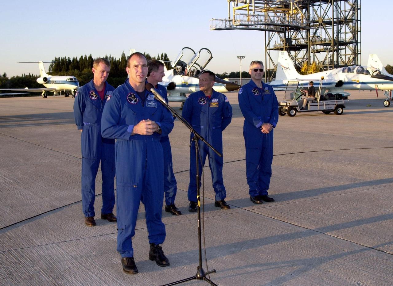 After their arrival at the Shuttle Landing Facility, the STS-97 crew gather to address the media. At the microphone is Pilot Michael Bloomfield. Behind him stand Commander Brent Jett and Mission Specialists Joseph Tanner, Carolos Noriega and Marc Garneau, who is with the Canadian Space Agency. Mission STS-97is the sixth construction flight to the International Space Station. Its payload includes the P6 Integrated Truss Structure and a photovoltaic (PV) module, with giant solar arrays that will provide power to the Station. The mission includes two spacewalks to complete the solar array connections. STS-97 is scheduled to launch Nov. 30 at about 10:06 p.m. EST