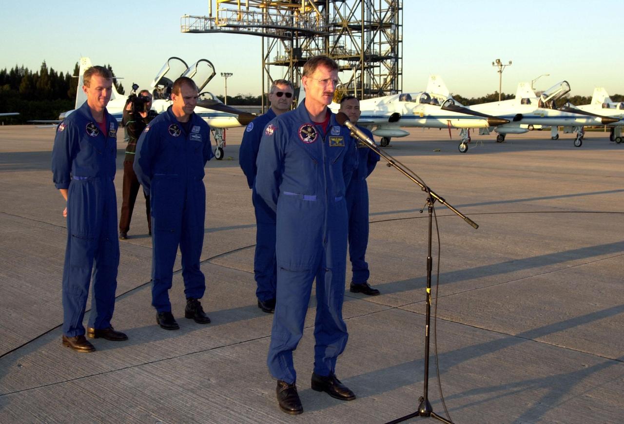 After their arrival at the Shuttle Landing Facility, the STS-97 crew gather to address the media. At the microphone is Mission Specialist Joseph Tanner. Behind him stand Commander Brent Jett, Pilot Michael Bloomfield and Mission Specialists Marc Garneau, who is with the Canadian Space Agency, and Carlos Noriega. Mission STS-97is the sixth construction flight to the International Space Station. Its payload includes the P6 Integrated Truss Structure and a photovoltaic (PV) module, with giant solar arrays that will provide power to the Station. The mission includes two spacewalks to complete the solar array connections. STS-97 is scheduled to launch Nov. 30 at about 10:06 p.m. EST