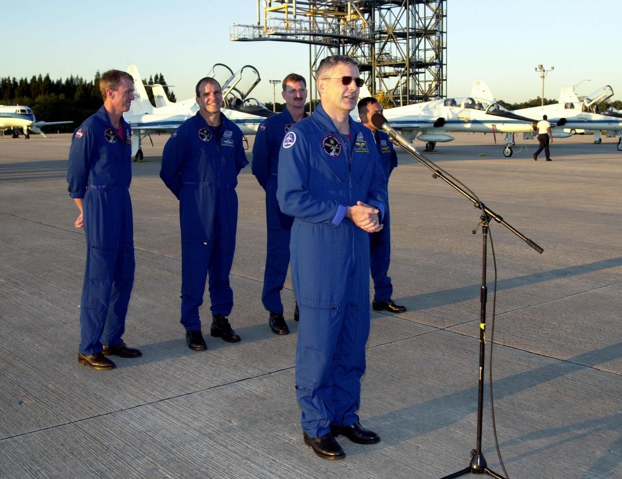 After their arrival at the Shuttle Landing Facility, the STS-97 crew gather to address the media. At the microphone is Mission Specialist Marc Garneau, who is with the Canadian Space Agency. Behind him stand Commander Brent Jett, Pilot Michael Bloomfield and Mission Specialists Joseph Tanner and Carlos Noriega. Mission STS-97is the sixth construction flight to the International Space Station. Its payload includes the P6 Integrated Truss Structure and a photovoltaic (PV) module, with giant solar arrays that will provide power to the Station. The mission includes two spacewalks to complete the solar array connections. STS-97 is scheduled to launch Nov. 30 at about 10:06 p.m. EST