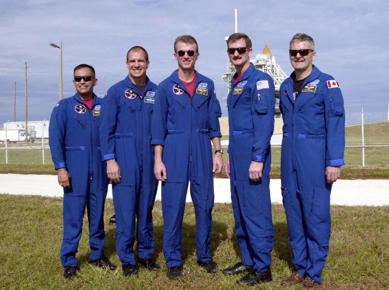 Gathered at Launch Pad 39B, the STS-97 crew pause for a photo. Standing left to right are Mission Specialist Carlos Noriega, Pilot Michael Bloomfield, Commander Brent Jett and Mission Specialists Joseph Tanner and Marc Garneau, who is with the Canadian Space Agency. The mission to the International Space Station carries the P6 Integrated Truss Segment containing solar arrays and batteries that will be temporarily installed to the Unity connecting module by the Z1 truss, recently delivered to and installed on the Station on mission STS-92. The two solar arrays are each more than 100 feet long. They will capture energy from the sun and convert it to power for the Station. Two spacewalks will be required to install the solar array connections. STS-97 is scheduled to launch Nov. 30 at about 10:06 p.m. EST