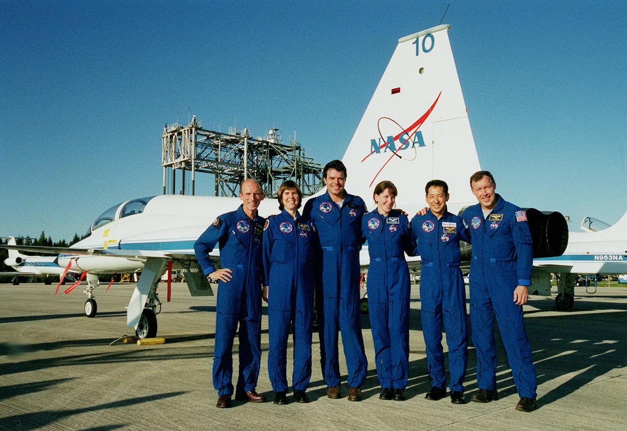 The STS-99 crew pose for a photo after their arrival at KSC's Shuttle Landing Facility. From left are Mission Specialists Gerhard Thiele, and Janice Voss (Ph.D.), Commander Kevin Kregel, Mission Specialists Janet Lynn Kavandi (Ph.D.) and Mamoru Mohri, and Pilot Dominic Gorie. Thiele is with the European Space Agency and Mohri is with the National Space Development Agency (NASDA) of Japan. The crew are here to take part in a Terminal Countdown Demonstration Test (TCDT), which provides simulated countdown exercises, emergency egress training, and opportunities to inspect the mission payloads in the orbiter's payload bay. STS-99 is the Shuttle Radar Topography Mission, which will chart a new course, using two antennae and a 200-foot-long section of space station-derived mast protruding from the payload bay to produce unrivaled 3-D images of the Earth's surface. The result of the Shuttle Radar Topography Mission could be close to 1 trillion measurements of the Earth's topography. Besides contributing to the production of better maps, these measurements could lead to improved water drainage modeling, more realistic flight simulators, better locations for cell phone towers, and enhanced navigation safety. Launch of Endeavour on the 11-day mission is scheduled for Jan. 31 at 12:47 p.m. EST