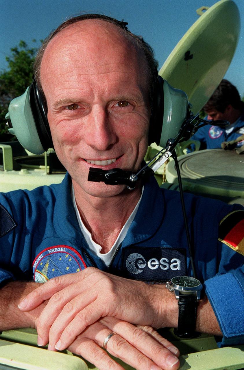 During Terminal Countdown Demonstration Test (TCDT) activities, STS-99 Mission Specialist Gerhard Thiele, who is with the European Space Agency, is ready to practice driving an armored personnel carrier that is part of emergency egress training and could be used by the crew in the event of an emergency at the pad during which the crew must make a quick exit from the area. TCDT provides the crew with simulated countdown exercises, emergency egress training, and opportunities to inspect the mission payloads in the orbiter's payload bay. STS-99 is the Shuttle Radar Topography Mission, which will chart a new course, using two antennae and a 200-foot-long section of space station-derived mast protruding from the payload bay to produce unrivaled 3-D images of the Earth's surface. The result of the Shuttle Radar Topography Mission could be close to 1 trillion measurements of the Earth's topography. Besides contributing to the production of better maps, these measurements could lead to improved water drainage modeling, more realistic flight simulators, better locations for cell phone towers, and enhanced navigation safety. Launch of Endeavour on the 11-day mission is scheduled for Jan. 31 at 12:47 p.m. EST