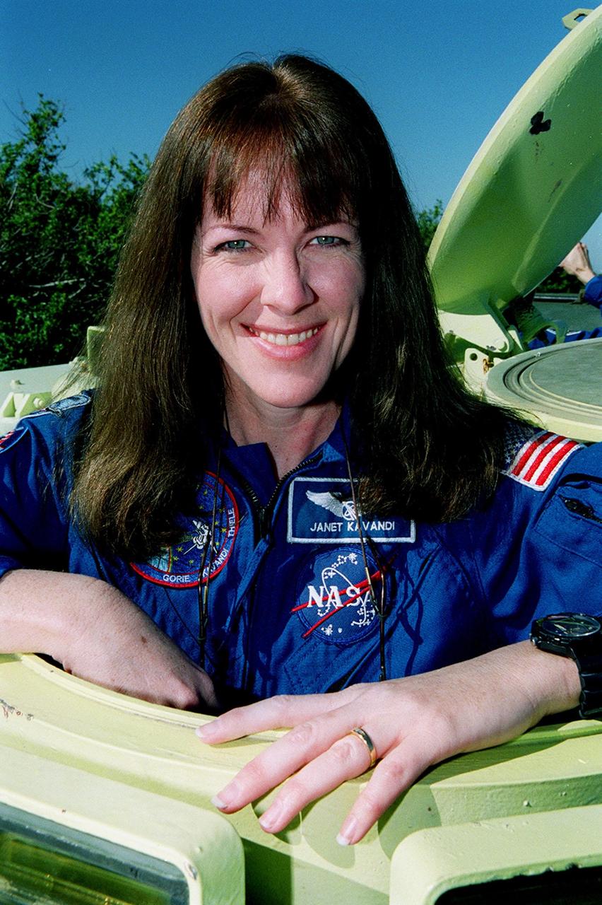 During Terminal Countdown Demonstration Test (TCDT) activities, STS-99 Mission Specialist Janet Lynn Kavandi (Ph.D.) is ready to practice driving the M-113, an armored personnel carrier. Part of Terminal Countdown Demonstration Test (TCDT) activities, the M-113 could be used by the crew in the event of an emergency at the pad during which the crew must make a quick exit from the area. TCDT provides the crew with simulated countdown exercises, emergency egress training, and opportunities to inspect the mission payloads in the orbiter's payload bay. STS-99 is the Shuttle Radar Topography Mission, which will chart a new course, using two antennae and a 200-foot-long section of space station-derived mast protruding from the payload bay to produce unrivaled 3-D images of the Earth's surface. The result of the Shuttle Radar Topography Mission could be close to 1 trillion measurements of the Earth's topography. Besides contributing to the production of better maps, these measurements could lead to improved water drainage modeling, more realistic flight simulators, better locations for cell phone towers, and enhanced navigation safety. Launch of Endeavour on the 11-day mission is scheduled for Jan. 31 at 12:47 p.m. EST