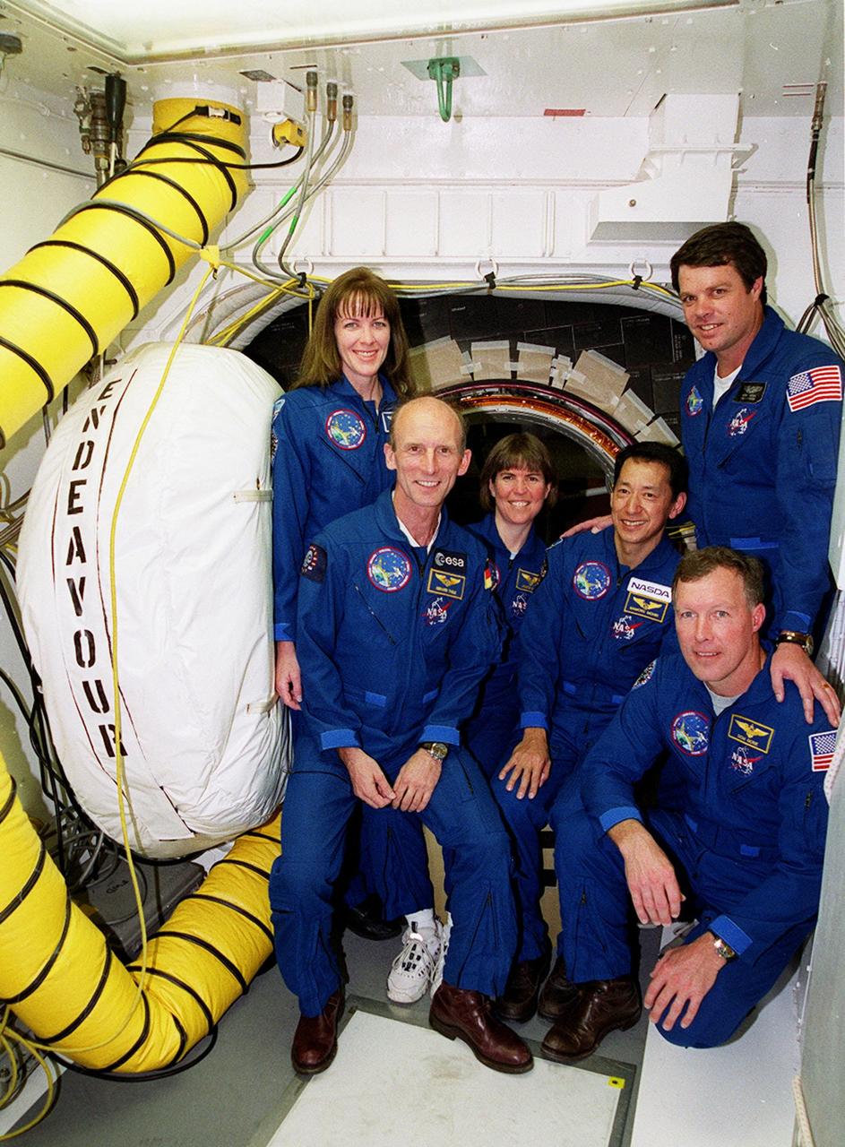 Inside the White Room attached to the Fixed Service Structure on Launch Pad 39A, the STS-99 crew pose at the entrance to the orbiter Endeavour. From left are Mission Specialists Janet Lynn Kavandi (Ph.D.), Gerhard Thiele, Janice Voss (Ph.D.) and Mamoru Mohri, Commander Kevin Kregel (standing) and Pilot Dominic Gorie (kneeling in front). Thiele is with the European Space Agency and Mohri is with the National Space Development Agency (NASDA) of Japan. The crew are taking part in Terminal Countdown Demonstration Test activities, which provide them with simulated countdown exercises, emergency egress training, and opportunities to inspect the mission payloads in the orbiter's payload bay. STS-99 is the Shuttle Radar Topography Mission, which will chart a new course, using two antennae and a 200-foot-long section of space station-derived mast protruding from the payload bay to produce unrivaled 3-D images of the Earth's surface. The result of the Shuttle Radar Topography Mission could be close to 1 trillion measurements of the Earth's topography. Besides contributing to the production of better maps, these measurements could lead to improved water drainage modeling, more realistic flight simulators, better locations for cell phone towers, and enhanced navigation safety. Launch of Endeavour on the 11-day mission is scheduled for Jan. 31 at 12:47 p.m. EST