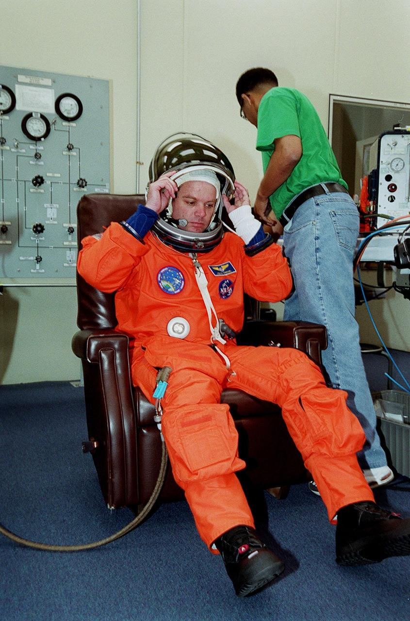 STS-99 Mission Commander Kevin Kregel suits up in the Operations and Checkout Building, as part of a flight crew equipment fit check, prior to his trip to Launch Pad 39A. The crew is taking part in Terminal Countdown Demonstration Test (TCDT) activities that provide the crew with simulated countdown exercises, emergency egress training, and opportunities to inspect the mission payloads in the orbiter's payload bay. STS-99 is the Shuttle Radar Topography Mission, which will chart a new course, using two antennae and a 200-foot-long section of space station-derived mast protruding from the payload bay to produce unrivaled 3-D images of the Earth's surface. The result of the Shuttle Radar Topography Mission could be close to 1 trillion measurements of the Earth's topography. Besides contributing to the production of better maps, these measurements could lead to improved water drainage modeling, more realistic flight simulators, better locations for cell phone towers, and enhanced navigation safety. Launch of Endeavour on the 11-day mission is scheduled for Jan. 31 at 12:47 p.m. EST