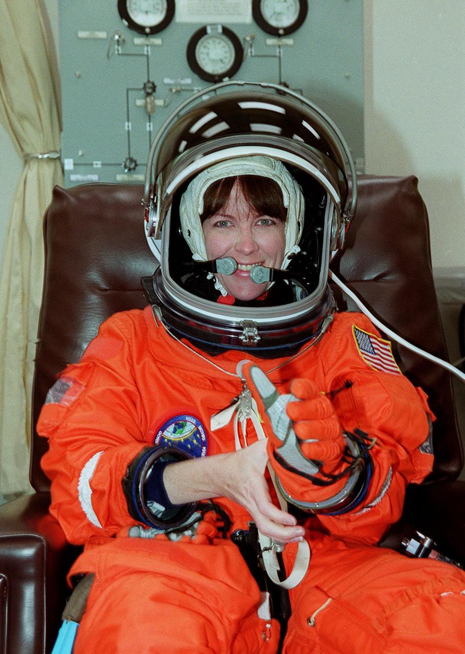 STS-99 Mission Specialist Janet Kavandi (Ph.D.) suits up in the Operations and Checkout Building, as part of a flight crew equipment fit check, prior to her trip to Launch Pad 39A. The crew is taking part in Terminal Countdown Demonstration Test (TCDT) activities that provide the crew with simulated countdown exercises, emergency egress training, and opportunities to inspect the mission payloads in the orbiter's payload bay. STS-99 is the Shuttle Radar Topography Mission, which will chart a new course, using two antennae and a 200-foot-long section of space station-derived mast protruding from the payload bay to produce unrivaled 3-D images of the Earth's surface. The result of the Shuttle Radar Topography Mission could be close to 1 trillion measurements of the Earth's topography. Besides contributing to the production of better maps, these measurements could lead to improved water drainage modeling, more realistic flight simulators, better locations for cell phone towers, and enhanced navigation safety. Launch of Endeavour on the 11-day mission is scheduled for Jan. 31 at 12:47 p.m. EST
