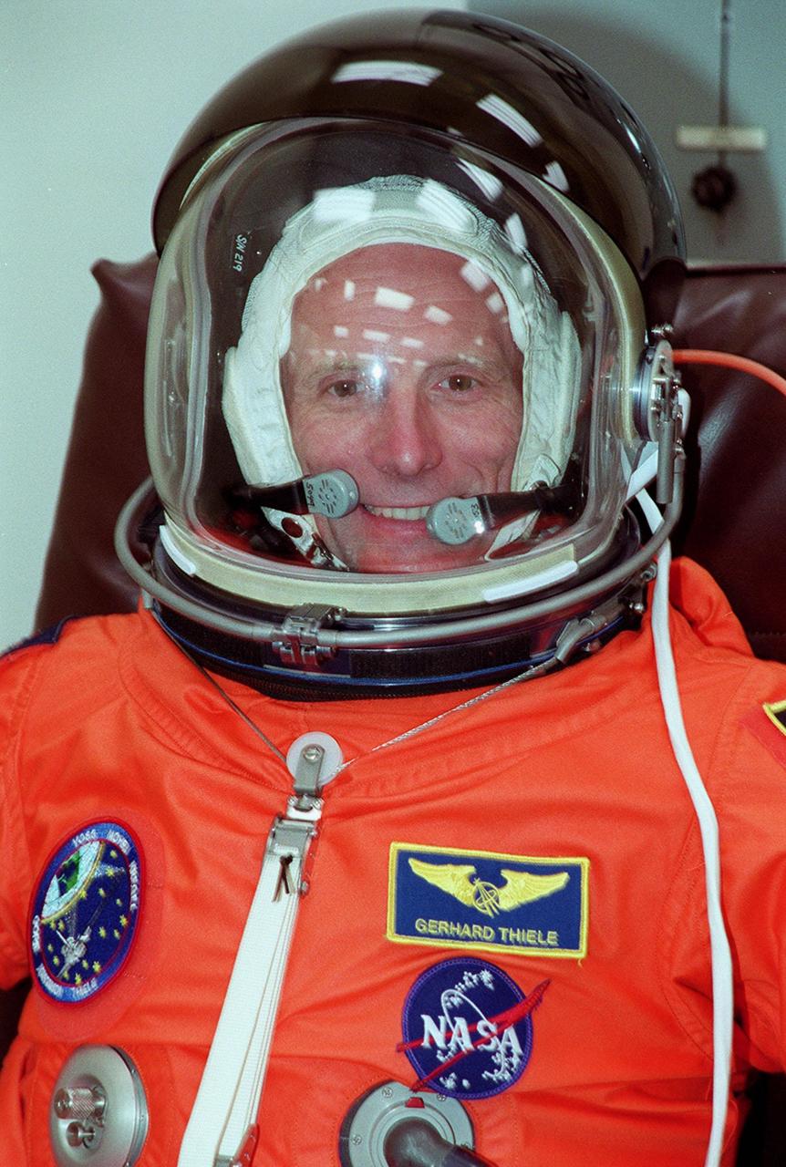 STS-99 Mission Specialist Gerhard Thiele, with the European Space Agency, suits up in the Operations and Checkout Building, as part of a flight crew equipment fit check, prior to his trip to Launch Pad 39A. The crew is taking part in Terminal Countdown Demonstration Test (TCDT) activities that provide the crew with simulated countdown exercises, emergency egress training, and opportunities to inspect the mission payloads in the orbiter's payload bay. STS-99 is the Shuttle Radar Topography Mission, which will chart a new course, using two antennae and a 200-foot-long section of space station-derived mast protruding from the payload bay to produce unrivaled 3-D images of the Earth's surface. The result of the Shuttle Radar Topography Mission could be close to 1 trillion measurements of the Earth's topography. Besides contributing to the production of better maps, these measurements could lead to improved water drainage modeling, more realistic flight simulators, better locations for cell phone towers, and enhanced navigation safety. Launch of Endeavour on the 11-day mission is scheduled for Jan. 31 at 12:47 p.m. EST