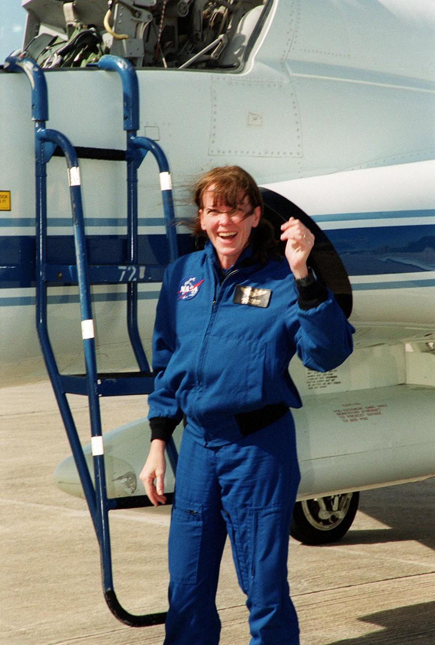 STS-99 Mission Specialist Janet Lynn Kavandi (Ph.D.) looks surprised and happy after landing at KSC aboard a T-38 jet aircraft to prepare for launch of Endeavour Jan. 31 at 12:47 p.m. EST. Over the next few days, the crew will review mission procedures, conduct test flights in the Shuttle Training Aircraft and undergo routine preflight medical exams. STS-99 is the Shuttle Radar Topography Mission, which will chart a new course, using two antennae and a 200-foot-long section of space station-derived mast protruding from the payload bay to produce unrivaled 3-D images of the Earth's surface. The result of the Shuttle Radar Topography Mission could be close to 1 trillion measurements of the Earth's topography. Besides contributing to the production of better maps, these measurements could lead to improved water drainage modeling, more realistic flight simulators, better locations for cell phone towers, and enhanced navigation safet