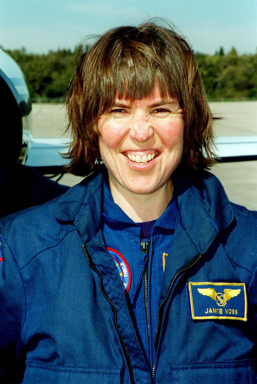 STS-99 Mission Specialist Janice Voss (Ph.D.) looks happy after landing at KSC aboard a T-38 jet aircraft to prepare for launch of Endeavour Jan. 31 at 12:47 p.m. EST. Over the next few days, the crew will review mission procedures, conduct test flights in the Shuttle Training Aircraft and undergo routine preflight medical exams. STS-99 is the Shuttle Radar Topography Mission, which will chart a new course, using two antennae and a 200-foot-long section of space station-derived mast protruding from the payload bay to produce unrivaled 3-D images of the Earth's surface. The result of the Shuttle Radar Topography Mission could be close to 1 trillion measurements of the Earth's topography. Besides contributing to the production of better maps, these measurements could lead to improved water drainage modeling, more realistic flight simulators, better locations for cell phone towers, and enhanced navigation safety