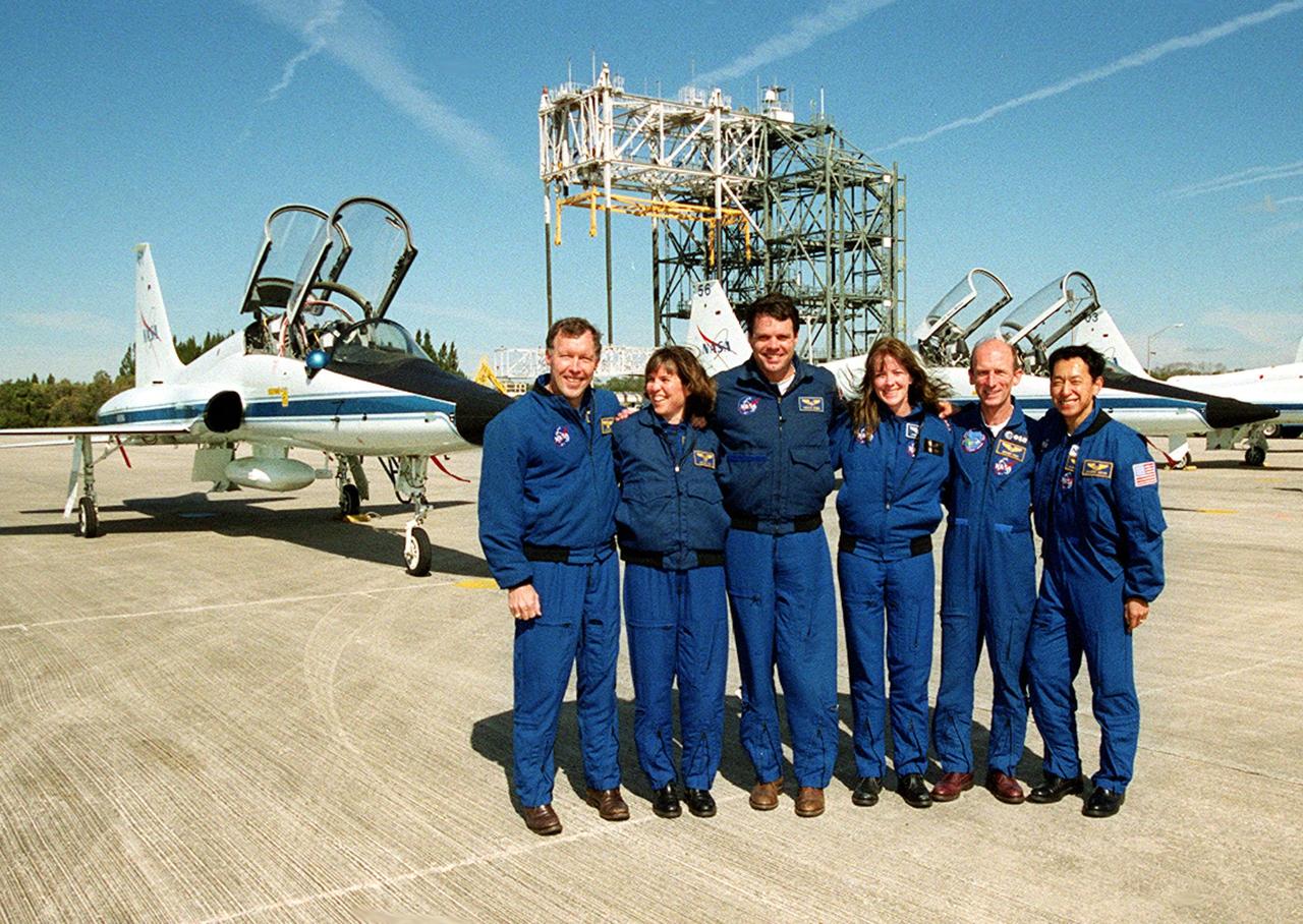 The STS-99 crew pose for a photograph after their arrival at the Shuttle Landing Facility to prepare for launch. From left are Pilot Dominic Gorie, Mission Specialist Janice Voss (Ph.D.), Commander Kevin Kregel, and Mission Specialists Janet Lynn Kavandi (Ph.D.), Gerhard Thiele (Ph.D.) and Mamoru Mohri (Ph.D.). Thiele is with the European Space Agency and Mohri is with the National Space Development Agency (NASDA) of Japan. Behind them are the T-38 jets in which they arrived, and the mate/demate device. Over the next few days, the crew will review mission procedures, conduct test flights in the Shuttle Training Aircraft and undergo routine preflight medical exams. STS-99 is the Shuttle Radar Topography Mission, which will chart a new course, using two antennae and a 200-foot-long section of space station-derived mast protruding from the payload bay to produce unrivaled 3-D images of the Earth's surface. The result of the Shuttle Radar Topography Mission could be close to 1 trillion measurements of the Earth's topography. Besides contributing to the production of better maps, these measurements could lead to improved water drainage modeling, more realistic flight simulators, better locations for cell phone towers, and enhanced navigation safety. Launch of Endeavour is scheduled for Jan. 31 at 12:47 p.m. EST