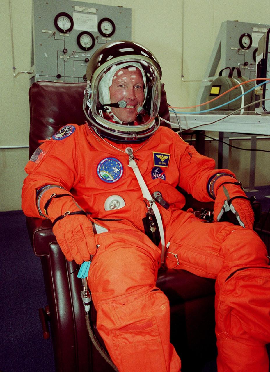 In the Operations and Checkout Building, STS-99 Pilot Dominic Gorie smiles during suitup in final launch preparations. Liftoff of STS-99, known as the Shuttle Radar Topography Mission, is scheduled for 12:47 p.m. EST from Launch Pad 39A. The SRTM will chart a new course to produce unrivaled 3-D images of the Earth's surface, using two antennae and a 200-foot-long section of space station-derived mast protruding from the payload bay. The result of the Shuttle Radar Topography Mission could be close to 1 trillion measurements of the Earth's topography. Besides contributing to the production of better maps, these measurements could lead to improved water drainage modeling, more realistic flight simulators, better locations for cell phone towers, and enhanced navigation safety. The mission is expected to last about 11days, with Endeavour landing at KSC Friday, Feb. 11, at 4:55 p.m. EST