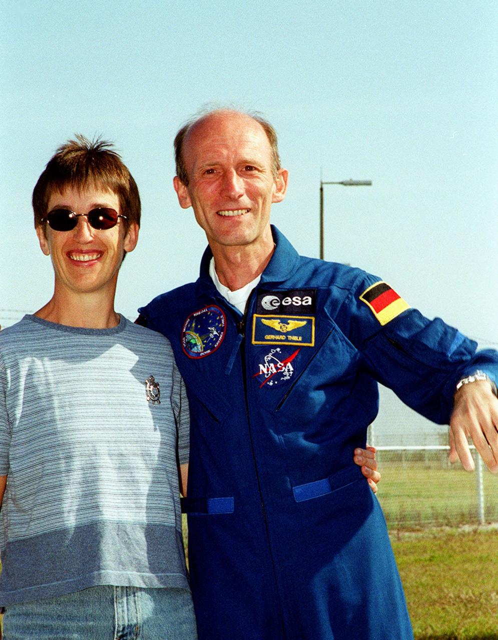 KENNEDY SPACE CENTER, Fla. -- The day before the expected launch of STS-99, Mission Specialist Gerhard Thiele enjoys a reunion with his wife near Launch Pad 39A where family and friends have gathered to greet the crew. STS-99, known as the Shuttle Radar Topography Mission (SRTM), is scheduled to lift off 12:47 p.m. EST from Launch Pad 39A. The SRTM will chart a new course to produce unrivaled 3-D images of the Earth's surface, using two antennae and a 200-foot-long section of space station-derived mast protruding from the payload bay. The result of the Shuttle Radar Topography Mission could be close to 1 trillion measurements of the Earth's topography. Besides contributing to the production of better maps, these measurements could lead to improved water drainage modeling, more realistic flight simulators, better locations for cell phone towers, and enhanced navigation safety. The mission is expected to last about 11days, with Endeavour landing at KSC Friday, Feb. 11, at 4:55 p.m
