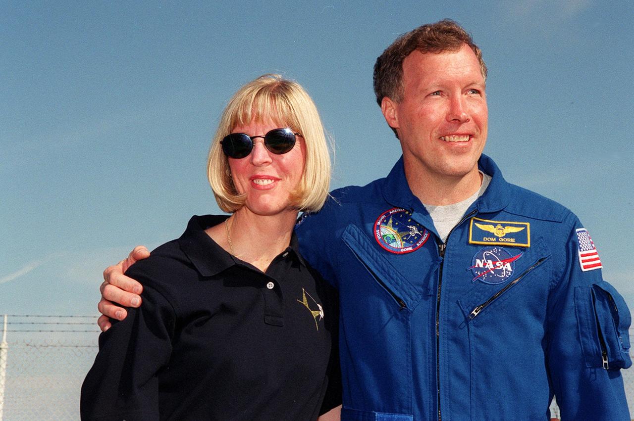 KENNEDY SPACE CENTER, Fla. -- The day before the expected launch of STS-99, Pilot Dominic Gorie enjoys a reunion with his wife, Wendy, near Launch Pad 39A where family and friends have gathered to greet the crew. STS-99, known as the Shuttle Radar Topography Mission (SRTM), is scheduled to lift off 12:47 p.m. EST from Launch Pad 39A. The SRTM will chart a new course to produce unrivaled 3-D images of the Earth's surface, using two antennae and a 200-foot-long section of space station-derived mast protruding from the payload bay. The result of the Shuttle Radar Topography Mission could be close to 1 trillion measurements of the Earth's topography. Besides contributing to the production of better maps, these measurements could lead to improved water drainage modeling, more realistic flight simulators, better locations for cell phone towers, and enhanced navigation safety. The mission is expected to last about 11days, with Endeavour landing at KSC Friday, Feb. 11, at 4:55 p.m