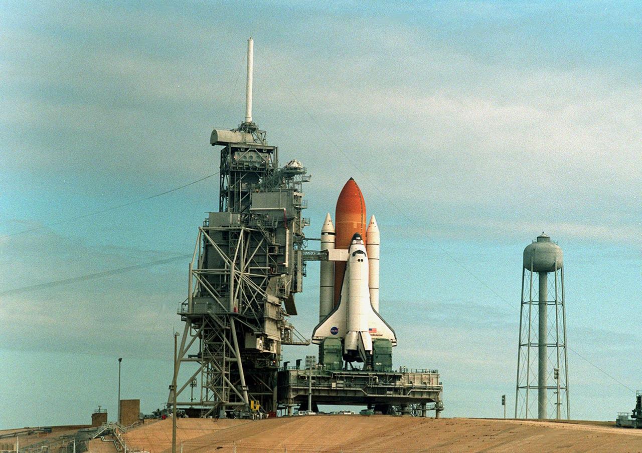 KENNEDY SPACE CENTER, Fla. --  Space Shuttle Endeavour sits on Launch Pad 39A waiting for the Rotating Service Structure to be rolled back into its protective position. The launch of Space Shuttle Endeavour on mission STS-99 was delayed when NASA managers decided to replace the Enhanced Master Events Controller that became suspect during the Jan. 31 launch countdown. The next scheduled launch is NET Feb. 9