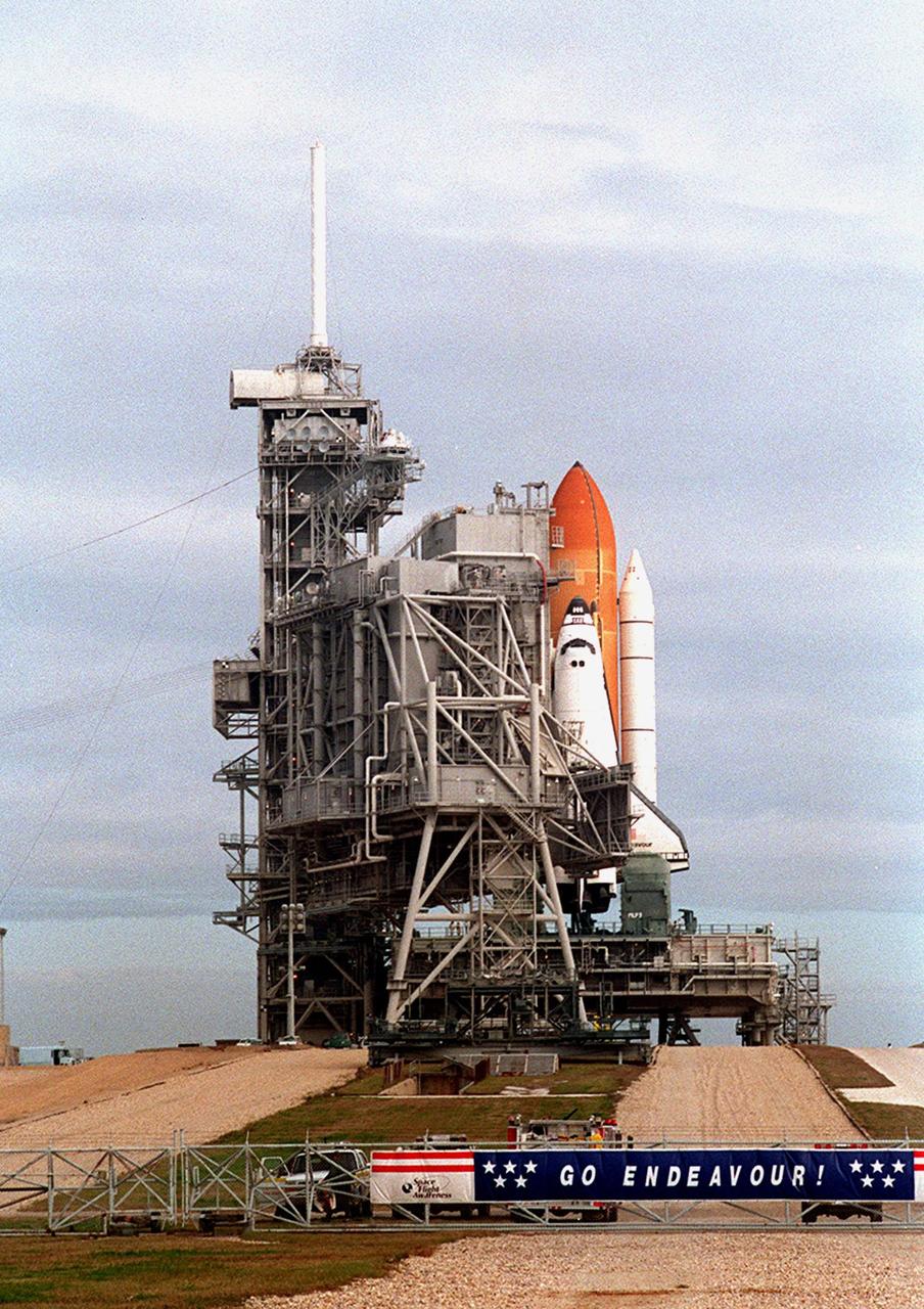KENNEDY SPACE CENTER, Fla. --  Under gray skies, the Rotating Service Structure rolls back into its protective position around Space Shuttle Endeavour on Launch Pad 39A. The launch of Endeavour on mission STS-99 was delayed when NASA managers decided to replace the Enhanced Master Events Controller that became suspect during the Jan. 31 launch countdown. The next scheduled launch is NET Feb. 9