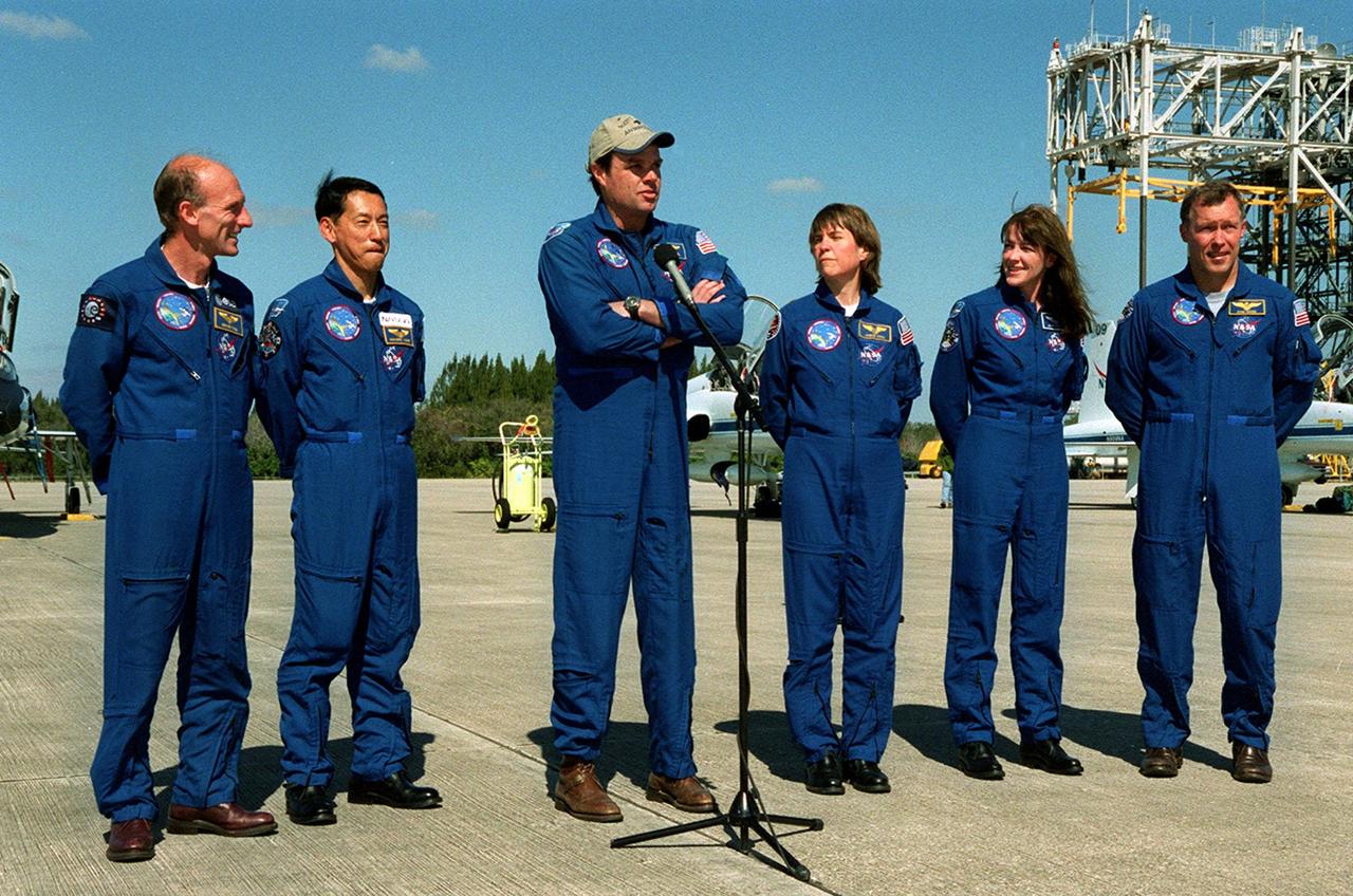 After landing at the Shuttle Landing Facility aboard T-38 jet aircraft, the STS-99 crew addresses the media. Standing, left to right, are Mission Specialists Gerhard Thiele of Germany and Mamoru Mohri of Japan, Commander Kevin Kregel (at the microphone), Mission Specialists Janice Voss and Janet Kavandi, and Pilot Dominic Gorie. They are ready to prepare for the second launch attempt of Endeavour Feb. 11 at 12:30 p.m. EST from Launch Pad 39A. The earlier launch scheduled for Jan. 31 was scrubbed due to poor weather and a faulty Enhanced Master Events Controller in the orbiter's aft compartment. Over the next few days, the crew will review mission procedures, conduct test flights in the Shuttle Training Aircraft and undergo routine preflight medical exams. STS-99 is the Shuttle Radar Topography Mission, which will produce unrivaled 3-D images of the Earth's surface. The result of the Shuttle Radar Topography Mission could be close to 1 trillion measurements of the Earth's topography. Landing is expected at KSC on Feb. 22 at 4:36 p.m. EST