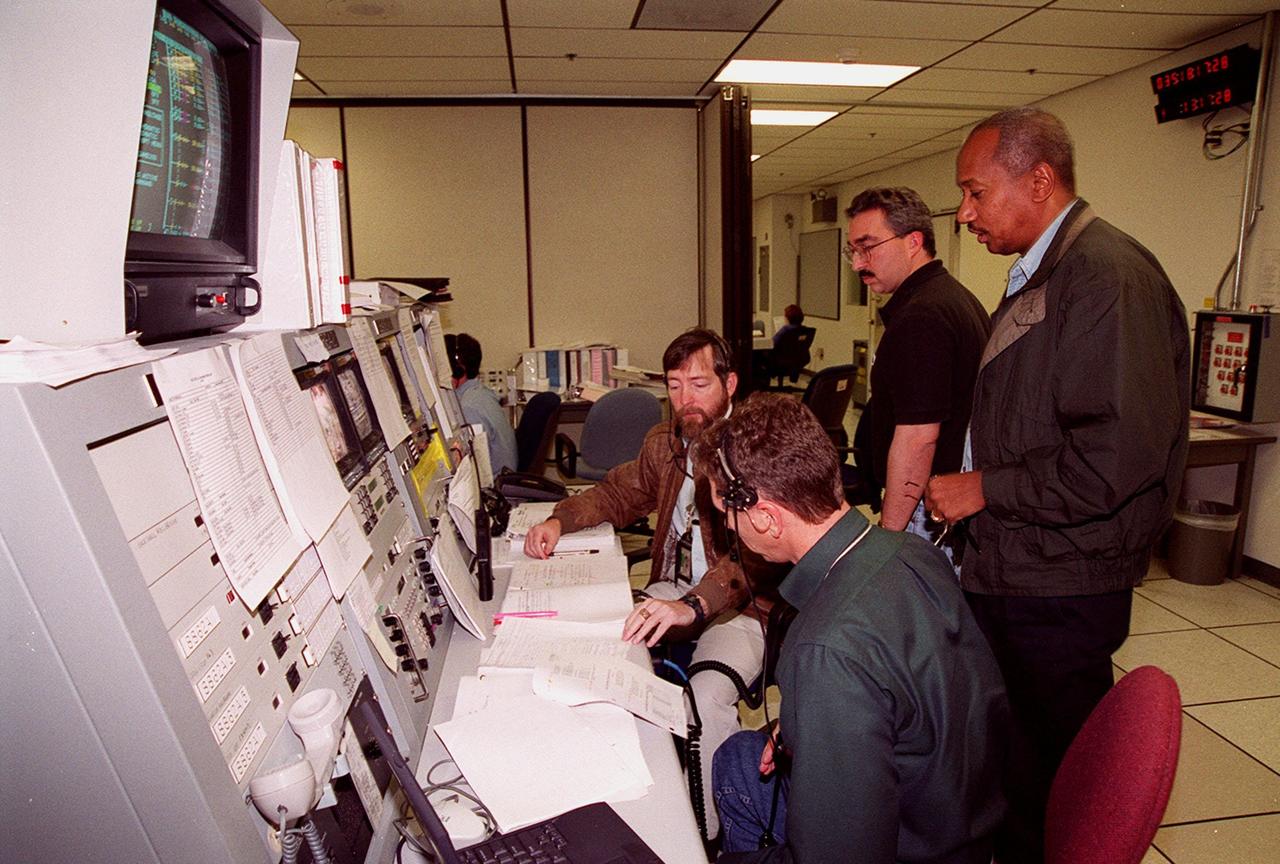 Workers in the Space Station Processing Facility control room check documentation during a Multi-Equipment Interface Test (MEIT) in the U.S. Lab Destiny. Members of the STS-98 crew are taking part in the MEIT checking out some of the equipment in the Lab. During the STS-98 mission, the crew will install the Lab on the station during a series of three space walks. The crew comprises five members: Commander Kenneth D. Cockrell, Pilot Mark L. Polansky, and Mission Specialists Robert L. Curbeam Jr., Thomas D. Jones (Ph.D.) and Marsha S. Ivins. The mission will provide the station with science research facilities and expand its power, life support and control capabilities. The U.S. Laboratory Module continues a long tradition of microgravity materials research, first conducted by Skylab and later Shuttle and Spacelab missions. Destiny is expected to be a major feature in future research, providing facilities for biotechnology, fluid physics, combustion, and life sciences research. The Lab is planned for launch aboard Space Shuttle Atlantis on the sixth ISS flight, currently targeted no earlier than Aug. 19, 2000