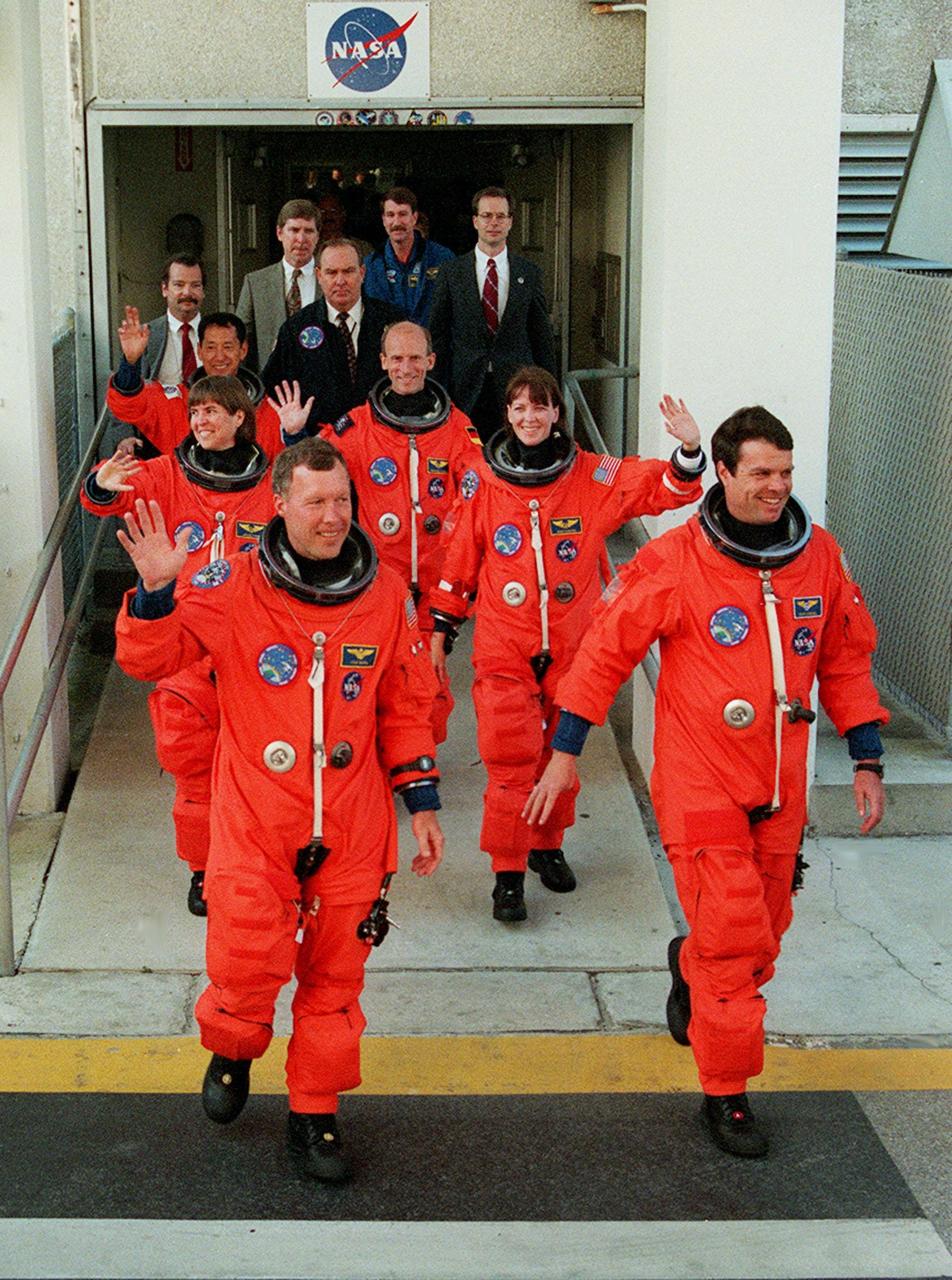 The STS-99 crew wave to onlookers as they step eagerly from the Operations and Checkout Building enroute to Launch Pad 39A for liftoff of Space Shuttle Endeavour. In their orange launch and entry suits, they are (foreground) Pilot Dominic Gorie and Commander Kevin Kregel. Behind them (left to right) are Mission Specialists Janice Voss, Mamoru Mohri of Japan, Gerhard Thiele of Germany and Janet Lynn Kavandi. Mohri is with the National Space Development Agency (NASDA) of Japan, and Thiele is with the European Space Agency. Known as the Shuttle Radar Topography Mission (SRTM), STS-99 is scheduled for liftoff at 12:30 p.m. EST. The SRTM will chart a new course to produce unrivaled 3-D images of the Earth's surface. The result of the Shuttle Radar Topography Mission could be close to 1 trillion measurements of the Earth's topography. The mission is expected to last 11days, with Endeavour landing at KSC Tuesday, Feb. 22, at 4:36 p.m. EST. This is the 97th Shuttle flight and 14th for Shuttle Endeavour