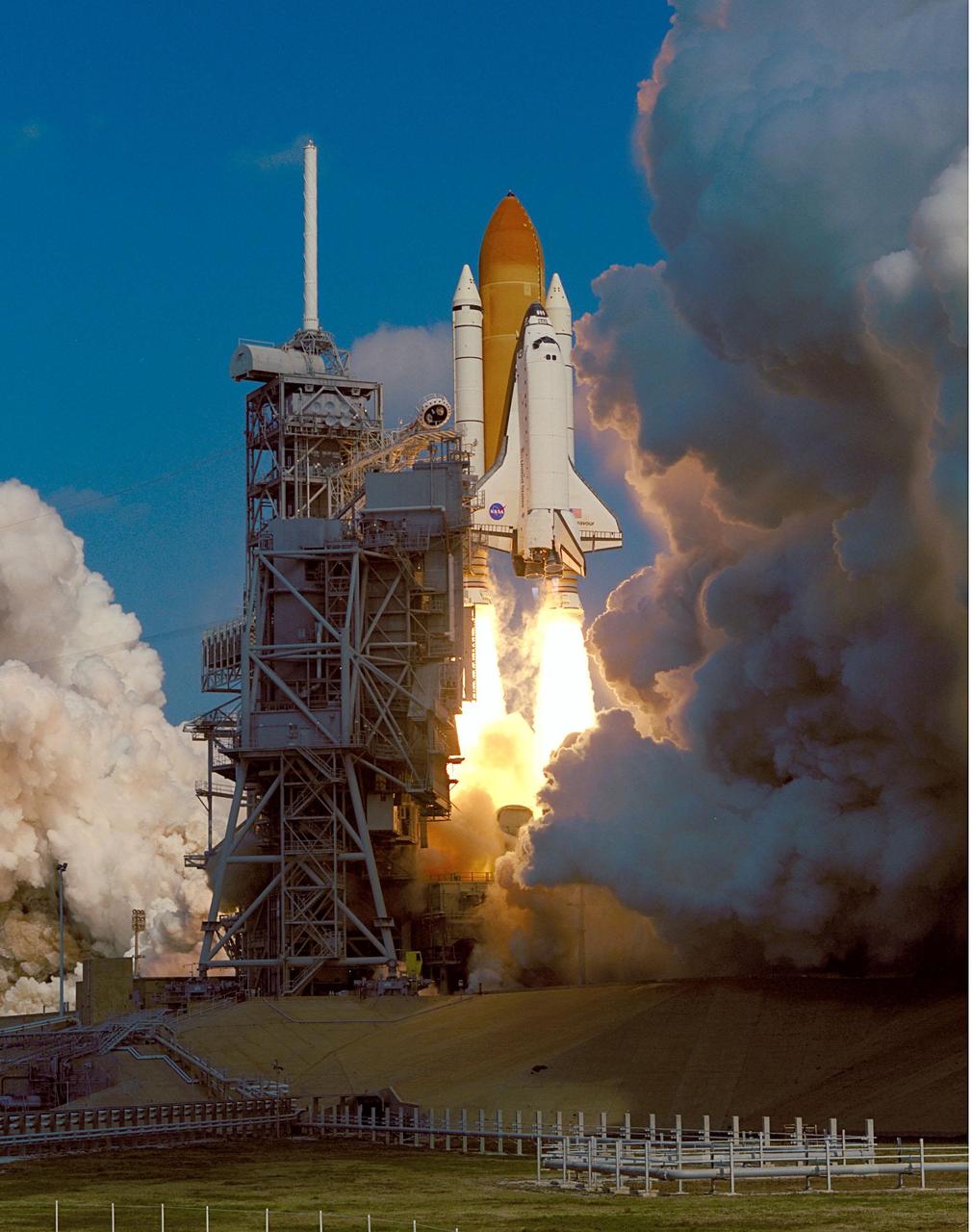 KENNEDY SPACE CENTER, Fla. -- Clouds of steam and smoke nearly surround Space Shuttle Endeavour as it rises past the launch tower on Launch Pad 39A. Liftoff of the Shuttle on mission STS-99 occurred at 12:43:40 p.m. EST. Known as the Shuttle Radar Topography Mission (SRTM), STS-99 will chart a new course to produce unrivaled 3-D images of the Earth's surface. The result of the SRTM could be close to 1 trillion measurements of the Earth's topography. The mission is expected to last 11days, with Endeavour landing at KSC Tuesday, Feb. 22, at 4:36 p.m. EST. This is the 97th Shuttle flight and 14th for Shuttle Endeavour