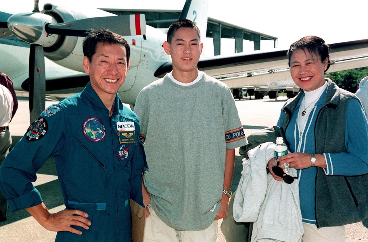 STS-99 Mission Specialist Mamoru Mohri (left) is joined by his son and wife, Akiko, at the Shuttle Landing Facility before their departure for Houston. The STS-99 crew completed a successful 11-day Shuttle Radar Topography Mission mapping 47 million square miles of the Earth's surface before landing at KSC Feb. 22