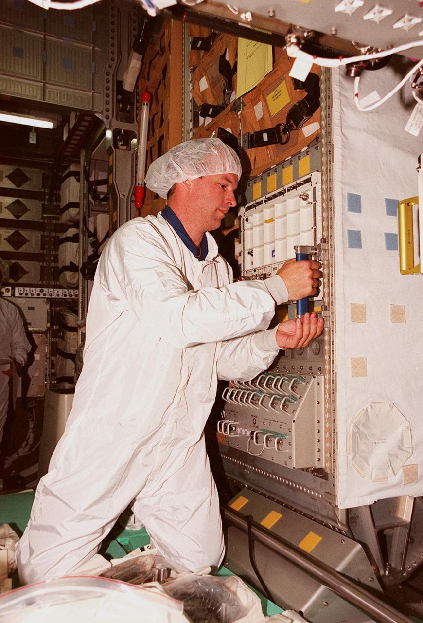 STS-101 Mission Specialist Jeffrey Williams gets hands-on experience with equipment inside the SPACEHAB double module, part of the cargo on the STS-101 mission to the International Space Station. Williams and the rest of the crew are taking part in Crew Equipment Interface Test (CEIT) activities to become familiar with equipment for their mission. The crew will be responsible for preparing the Space Station for the arrival of the Zvezda Service Module, expected to be launched by Russia in July 2000. Also, the crew will conduct one space walk to perform maintenance on the Space Station and deliver logistics and supplies. This will be the third assembly flight for the Space Station. STS-101 is scheduled to launch no earlier than April 13 from Launch Pad 39A