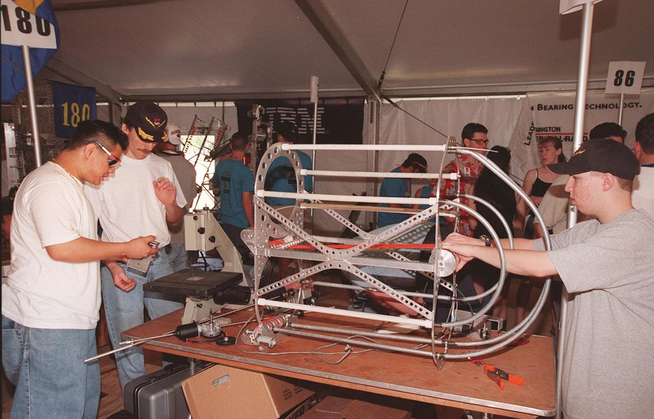 Students from high schools around the United States busily prepare their robots for the FIRST (For Inspiration and Recognition of Science and Technology) Southeast Regional competition March 9-11 at the KSC Visitor Complex. Teams of high school students are testing the limits of their imagination using robots they have designed, with the support of business and engineering professionals and corporate sponsors, to compete in a technological battle against other schools' robots. Of the 30 high school teams competing at KSC, 16 are Florida teams co-sponsored by NASA and KSC contractors. Local high schools participating are Astronaut, Bayside, Cocoa Beach, Eau Gallie, Melbourne, Melbourne Central Catholic, Palm Bay, Rockledge, Satellite, and Titusville
