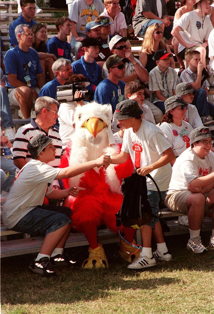 FIRST team members and friends enjoy the FIRST event. Students from all over the country are at the KSC Visitor Complex for the FIRST (For Inspiration and Recognition of Science and Technology) Southeast Regional competition March 9-11 in the Rocket Garden. Teams of high school students are testing the limits of their imagination using robots they have designed, with the support of business and engineering professionals and corporate sponsors, to compete in a technological battle against other schools' robots. Of the 30 high school teams competing, 16 are Florida teams co-sponsored by NASA and KSC contractors. Local high schools participating are Astronaut, Bayside, Cocoa Beach, Eau Gallie, Melbourne, Melbourne Central Catholic, Palm Bay, Rockledge, Satellite, and Titusville