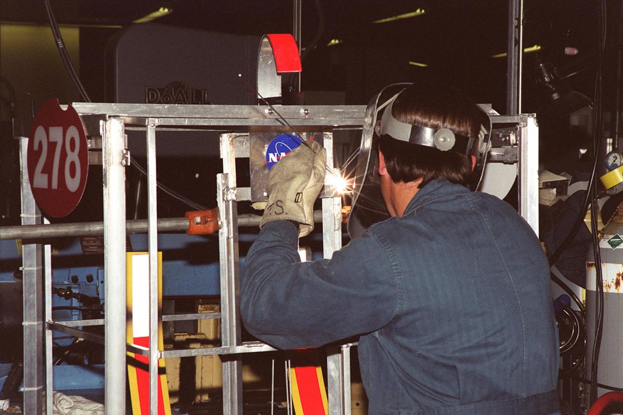 The Hero Team (278) robot, named Hero, is repaired in a Kennedy Space Center research and development machine shop. The team of Edgewater High School students was co-sponsored by NASA Kennedy Space Center and Honeywell. Students from all over the country are at the KSC Visitor Complex for the FIRST (For Inspiration and Recognition of Science and Technology) Southeast Regional competition March 9-11 in the Rocket Garden. Teams of high school students are testing the limits of their imagination using robots they have designed, with the support of business and engineering professionals and corporate sponsors, to compete in a technological battle against other schools' robots. Of the 30 high school teams competing, 16 are Florida teams co-sponsored by NASA and KSC contractors. Local high schools participating are Astronaut, Bayside, Cocoa Beach, Eau Gallie, Melbourne, Melbourne Central Catholic, Palm Bay, Rockledge, Satellite, and Titusville