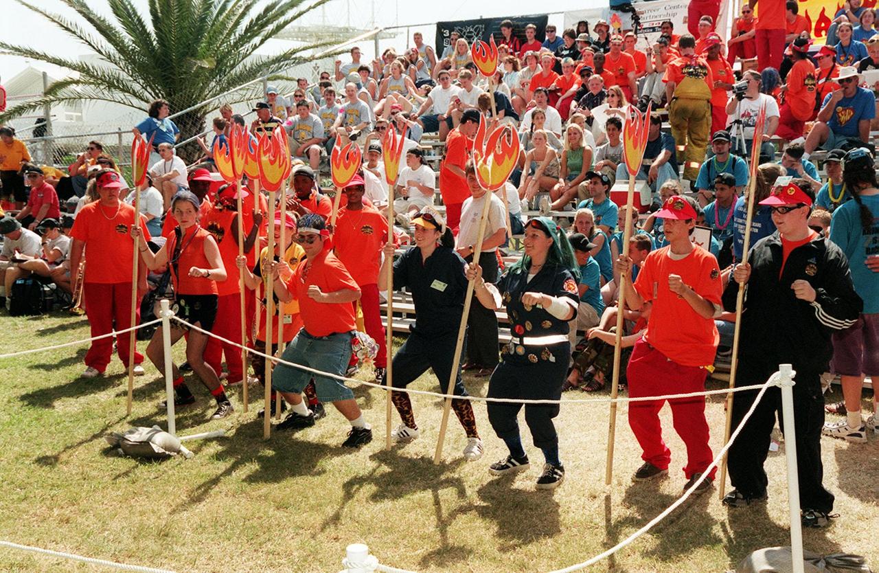 Members of a FIRST robotic team cheer their teammates on during early competition at the FIRST (For Inspiration and Recognition of Science and Technology) Southeast Regional competition held March 9-11 in the KSC Visitor Complex Rocket Garden. Teams of high school students from all over the country are testing the limits of their imagination using robots they have designed, with the support of business and engineering professionals and corporate sponsors, to compete in a technological battle against other schools' robots. Of the 30 high school teams competing at the Southeast Regional event, 16 are Florida teams co-sponsored by NASA and KSC contractors. Local high schools participating are Astronaut, Bayside, Cocoa Beach, Eau Gallie, Melbourne, Melbourne Central Catholic, Palm Bay, Rockledge, Satellite, and Titusville