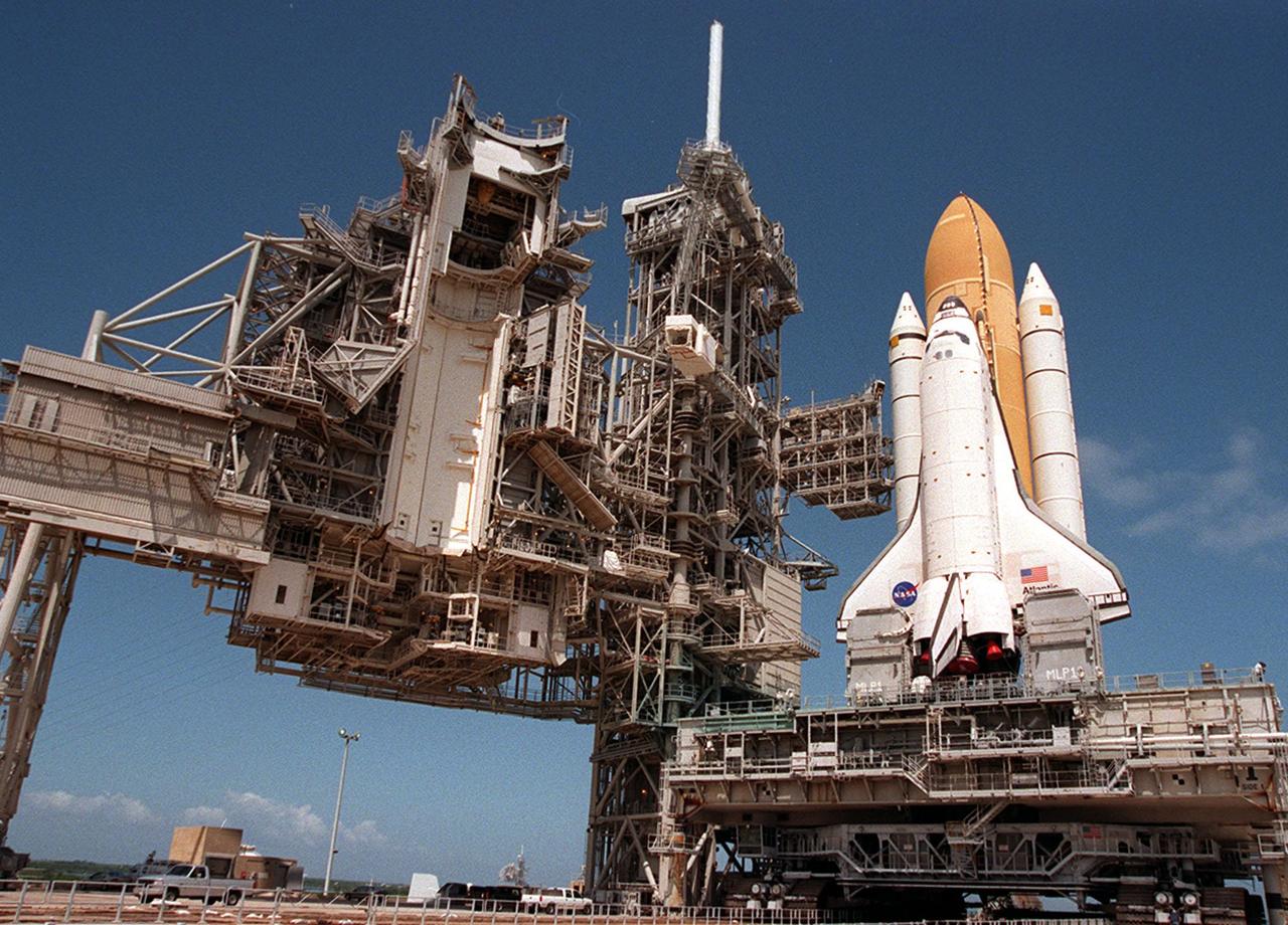 KENNEDY SPACE CENTER, FLA. -- Space Shuttle Atlantis sits on launch Pad 39A waiting for the rotating service structure, pictured at left, to be moved into place for final launch preparations. Liftoff of Atlantis on mission STS-101 is scheduled for April 17 at 7:03 p.m. EDT. STS-101 is a logistics and resupply mission for the International Space Station, to restore full redundancy to the International Space Station power system in preparation for the arrival of the next pressurized module, the Russian-built Zvezda