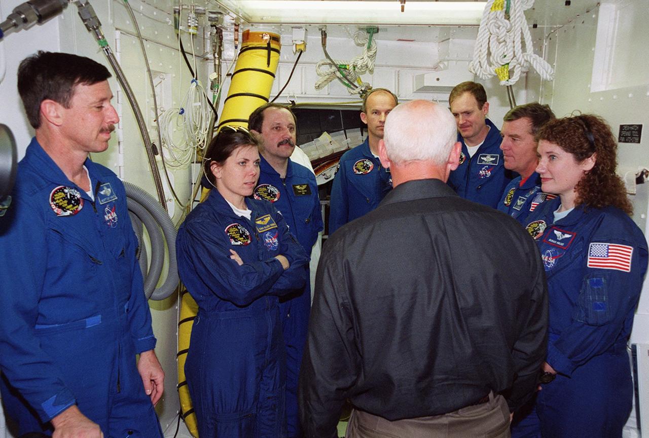 Inside the White Room at Launch Pad 39A, the STS-101 crew take part in training during a Terminal Countdown Demonstration Test (TCDT). Activities during TCDT include emergency egress from the orbiter and a dress rehearsal for launch. Standing left to right are Pilot Scott Horowitz, Mission Specialists Mary Ellen Weber, Yury Usachev and Jeffrey Williams, Commander James Halsell, and Mission Specialists James Voss and Susan Helms. During their mission to the International Space Station, the STS-101 crew will be delivering logistics and supplies, plus preparing the Station for the arrival of the Zvezda Service Module, expected to be launched by Russia in July 2000. Also, the crew will conduct one space walk to perform maintenance on the Space Station. This will be the third assembly flight for the Space Station. STS-101 is scheduled to launch April 24 at 4:15 p.m. from Launch Pad 39A