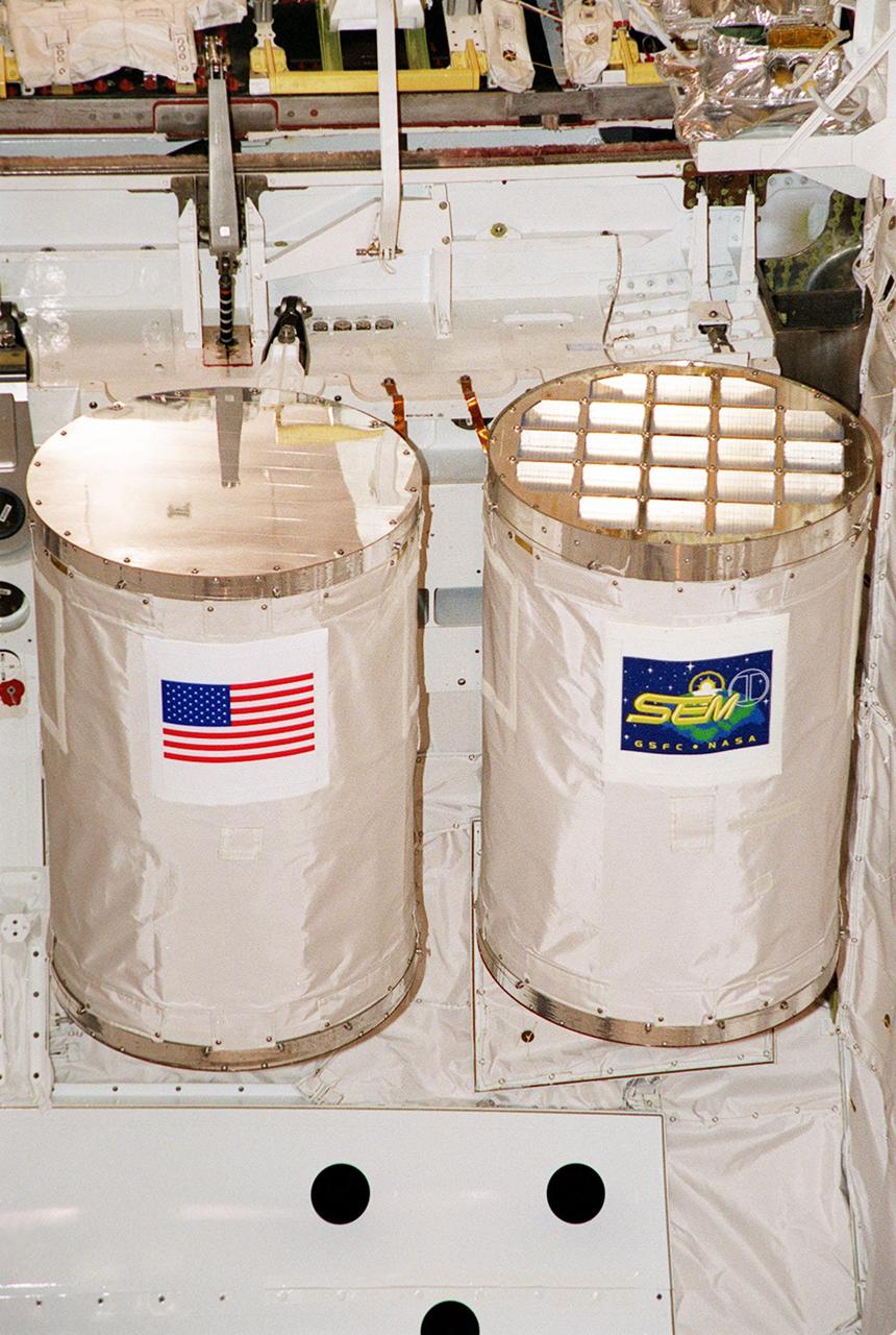 KENNEDY SPACE CENTER, FLA. -- Placed at the end of Space Shuttle Atlantis' payload bay are two GetAway Special (GAS) experiments, MARS (left) and SEM-06 (right). MARS is the name for part of the KSC Space Life Sciences Outreach Program. It includes 20 participating schools (ranging from elementary to high school) from all over the nation and one in Canada who have been involved in KSC Space Life Sciences projects over the past seven years. The MARS payload has 20 tubes filled with materials for various classroom investigations designed by the MARS schools. The SEM program is student-developed, focusing on the science of zero-gravity and microgravity. Selected student experiments on this sixth venture are testing the effects of space on Idaho tubers, seeds, paint, yeast, film, liquids, electronics and magnetic chips. The primary mission of STS-101 is to deliver logistics and supplies to the International Space Station, plus prepare the Station for the arrival of the Zvezda Service Module, expected to be launched by Russia in July 2000. The crew will conduct one space walk to perform maintenance on the Space Station. This will be the third assembly flight for the Space Station. STS-101 is scheduled to launch April 24 at 4:15 p.m. from Launch Pad 39A