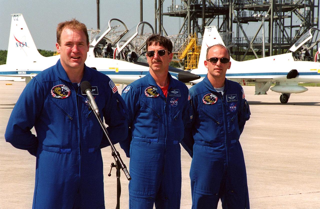 After arriving at the Shuttle Landing Facility for their launch preparations, the STS-101 crew pauses to greet the media. At the microphone is Commander James Halsell. Next to him (left to right) are Pilot Scott "Doc" Horowitz and Mission Specialist Jeffrey Williams. Other crew members not shown are Mission Specialists Mary Ellen Weber, James Voss, Susan Helms and Yury Usachev of Russia. The mission will take the crew to the International Space Station, delivering logistics and supplies, plus preparing the Station for the arrival of the Zvezda Service Module, expected to be launched by Russia in July 2000. Also, the crew will conduct one space walk to perform maintenance on the Space Station. This will be the third assembly flight for the Space Station. Launch is targeted for April 24 at about 4:15 p.m. EDT from Launch Pad 39A