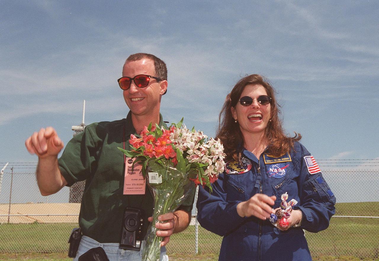 STS-101 Mission Specialist Mary Ellen Weber and her husband Jerome Elkind during a meeting of the STS-101 crew with family and friends at Launch Pad 39A. Mission STS-101 will take the crew to the International Space Station to deliver logistics and supplies, plus prepare the Station for the arrival of the Zvezda Service Module, expected to be launched by Russia in July 2000. The crew will conduct one space walk to perform maintenance on the Space Station as well. This will be the third assembly flight for the Space Station. Launch is targeted for April 24 at about 4:15 p.m. EDT from Launch Pad 39A