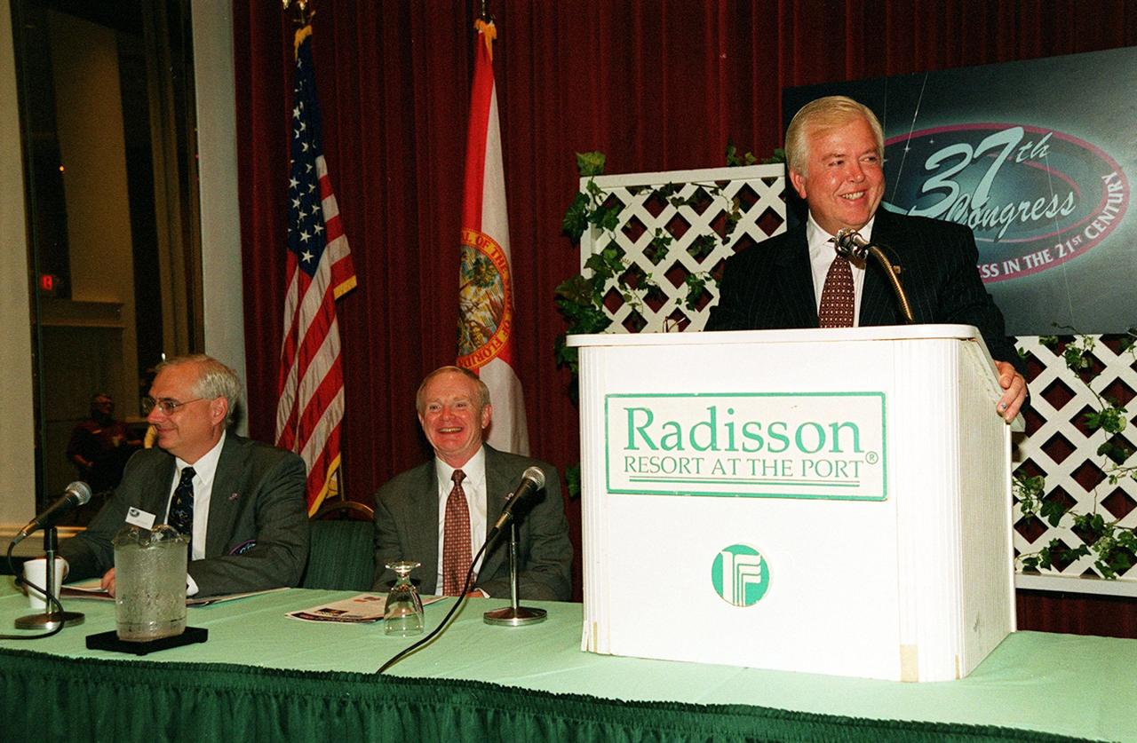 Lou Dobbs, chief executive officer of Space.com, speaks at Space Congress. Seated to his left are Roy Bridges Jr., Kennedy Space Center director, and Charles Murphy, general chairman of the event. The 37th Space Congress, sponsored by the Canaveral Council of Technical Societies, featured the theme &quot;Space Means Business in the 21st Century.&quot; The event was held at the Radisson Resort at the Port in Cape Canaveral