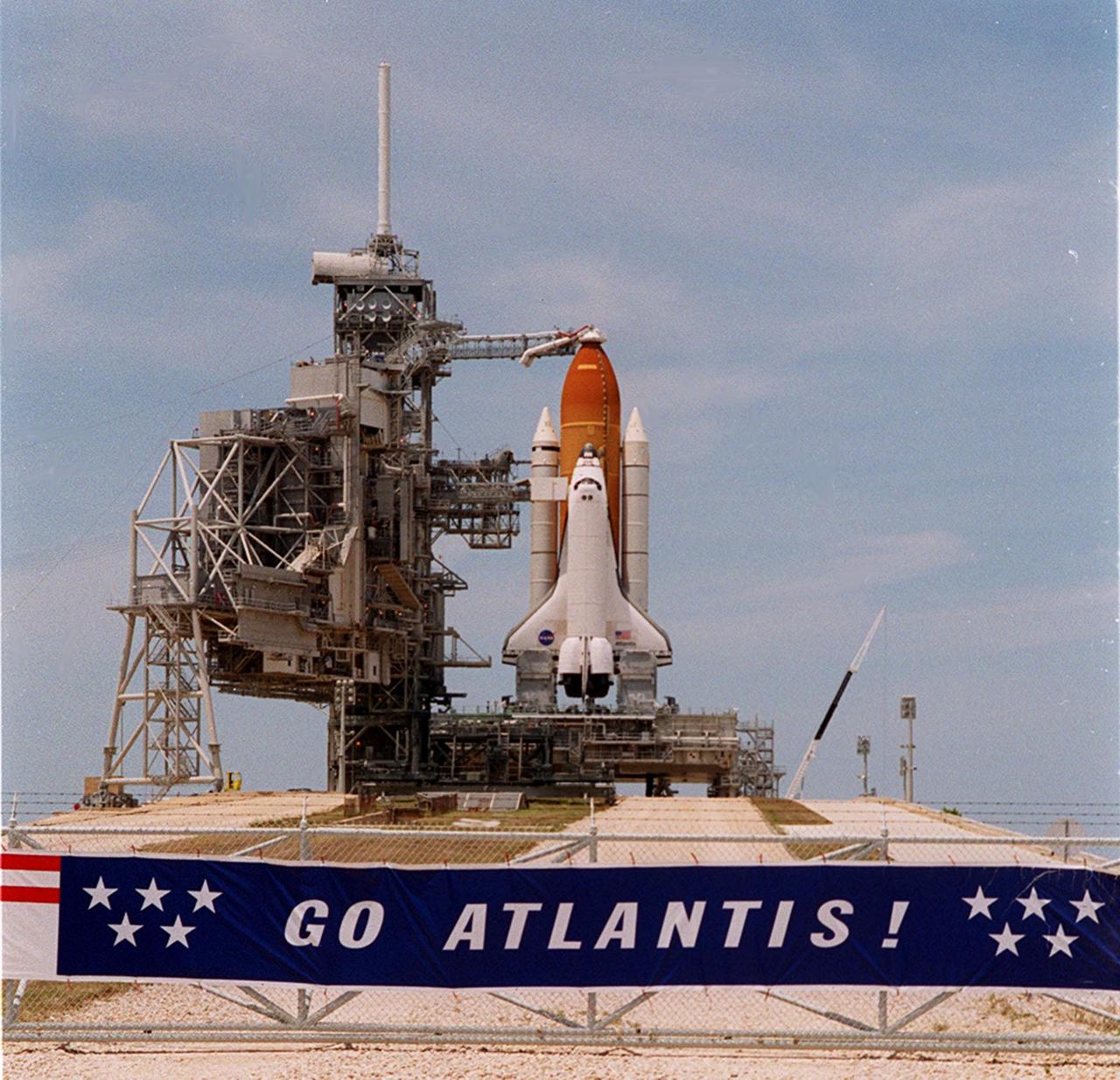 KENNEDY SPACE CENTER, Fla. -- After rollback of the Rotating Service Structure at Launch Pad 39A, Space Shuttle Atlantis awaits a fourth launch attempt on mission STS-101. At the top of the orange external tank can be seen the Gaseous Oxygen Vent Hood, often called the “beanie cap.” The hood helps vent gaseous oxygen vapors away from the Space Shuttle. The hood will be raised and retracted two and a half minutes before launch. Abutting the side of Atlantis is the orbiter access arm with the environmental chamber known as the White Room at the end. The White Room provides access to the crew compartment. This will be the third assembly flight to the International Space Station. Liftoff of Space Shuttle Atlantis for the 10-day mission is scheduled for about 6:12 a.m. EDT from Launch Pad 39A. Landing is targeted for May 29 at 2:19 a.m. EDT. This is the 98th Shuttle flight and the 21st flight for Shuttle Atlantis