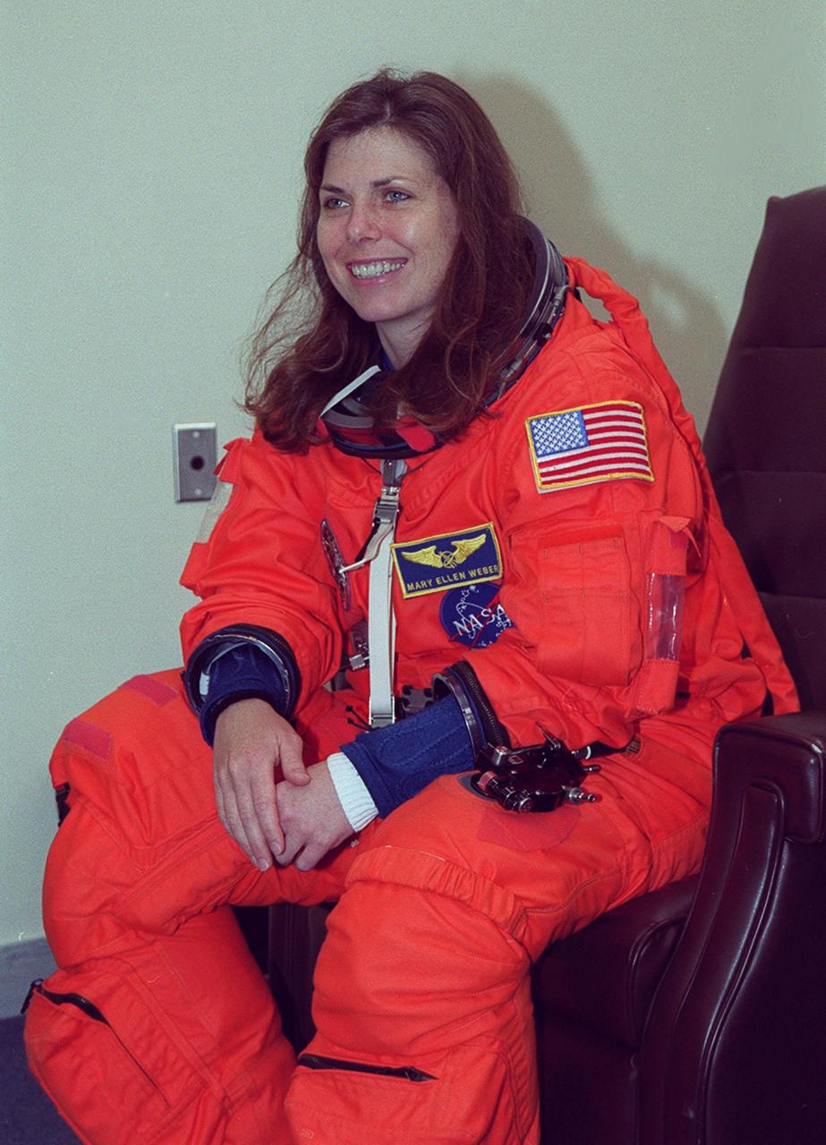 In the Operations and Checkout Building, STS-101 Mission Specialist Mary Ellen Weber relaxes during suitup before heading to Launch Pad 39A and launch of Space Shuttle Atlantis. The mission will take the crew to the International Space Station to deliver logistics and supplies and to prepare the Station for the arrival of the Zvezda Service Module, expected to be launched by Russia in July 2000. Also, the crew will conduct one space walk and will reboost the space station from 230 statute miles to 250 statute miles. This will be the third assembly flight to the Space Station. Liftoff of Space Shuttle Atlantis for the 10-day mission is scheduled for about 6:11 a.m. EDT from Launch Pad 39A. Landing is targeted for May 29 at 2:19 a.m. EDT