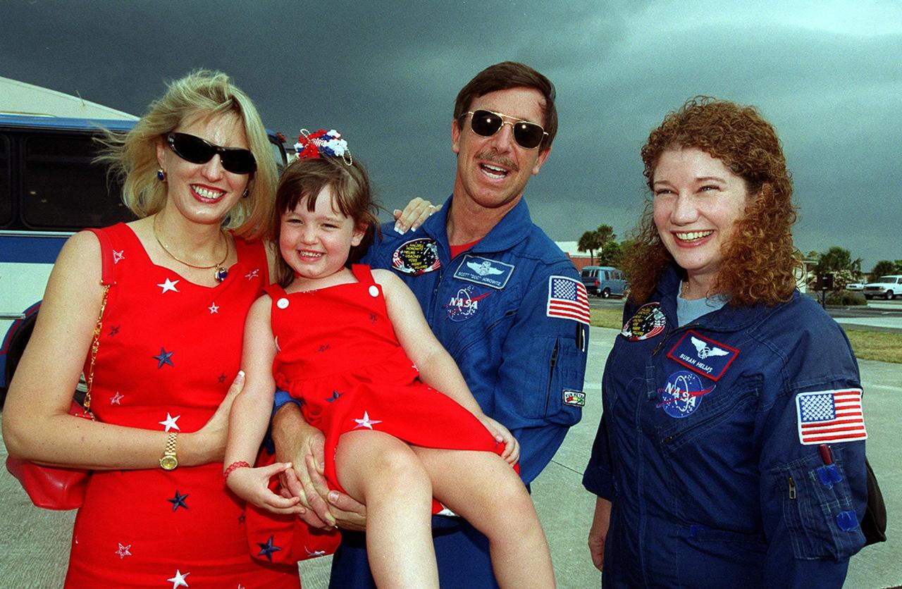 Members of the STS-101 crew gather with families and friends at Patrick Air Force Base before departure for Houston. Pilot Scott “Doc” Horowitz is joined by his wife, Lisa, and daughter; Mission Specialist Susan J. Helms is at right. After landing at 2:20 a.m. EDT May 29, the crew and their families enjoyed the Memorial Day holiday in Florida. The crew returned from the third flight to the International Space Station where they made repairs, transferred cargo and completed a space walk to install and connect several pieces of equipment on the outside of the Space Station