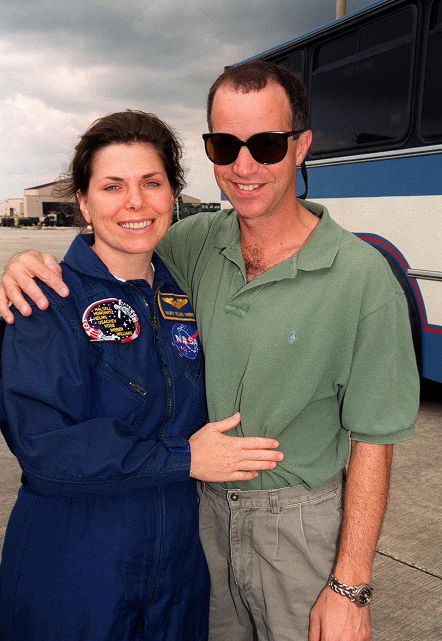 Members of the STS-101 crew gather with families and friends at Patrick Air Force Base before departure for Houston. Mission Specialist Mary Ellen Weber is joined by her husband, Dr. Jerome Elkind. After landing at 2:20 a.m. EDT May 29, the crew and their families enjoyed the Memorial Day holiday in Florida. The crew returned from the third flight to the International Space Station where they made repairs, transferred cargo and completed a space walk to install and connect several pieces of equipment on the outside of the Space Station