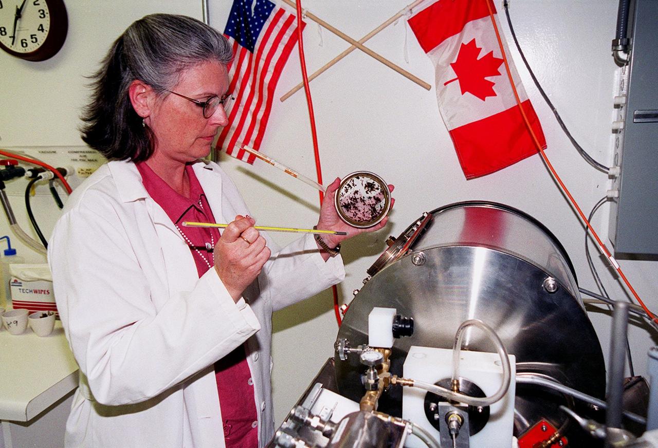 Visiting scientist Cheryl Frazier monitors a prototype composting machine in Hangar L at the Cape Canaveral Air Force Station. The research she is performing is one of many studies at the Biological Sciences Branch in the Spaceport Engineering and Technology Directorate at Kennedy Space Center. The branch's operations and research areas include life sciences Space Shuttle payloads, bioregenerative life-support for long-duration spaceflight and environmental/ecological stewardship