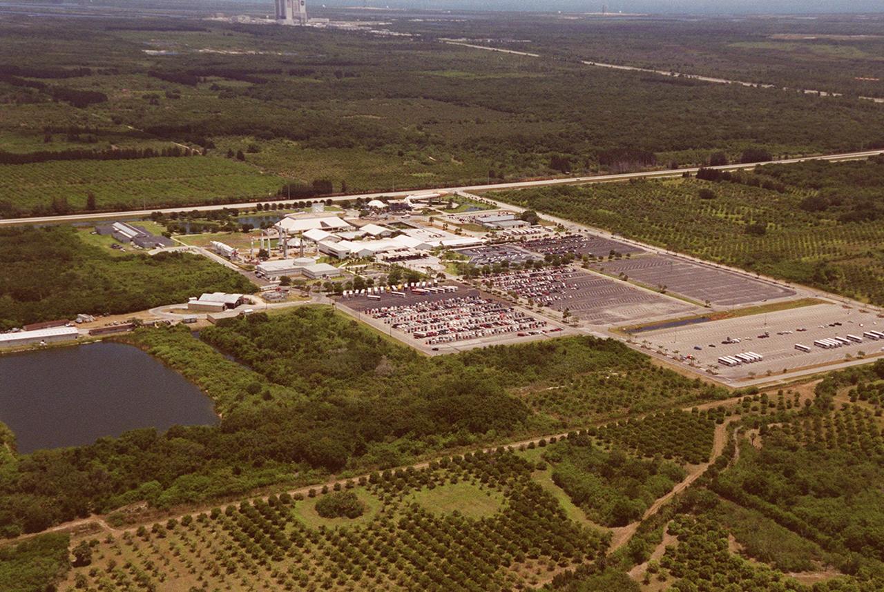 This aerial view is of Kennedy Space Center's Visitor Complex. The Vehicle Assembly Building, located in the Launch Complex 39 area, can be seen in the background