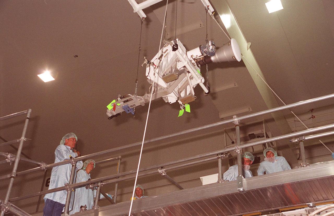 An overhead crane in the Space Station Processing Facility moves an S-band Antenna Support Assembly (SASA) to the Integrated Truss Structure (ITS) Z1, an element of the International Space Station. . The antenna will be attached to the truss. The SASA antenna is primarily for local communications between the orbiter and Space Station. The Z1 is an early exterior framework to allow the first U.S. solar arrays, on mission STS-97, flight 4A, to be temporarily installed on Unity for early power. The Z1 is scheduled on mission STS-92, the fifth flight to the Space Station, in the fall